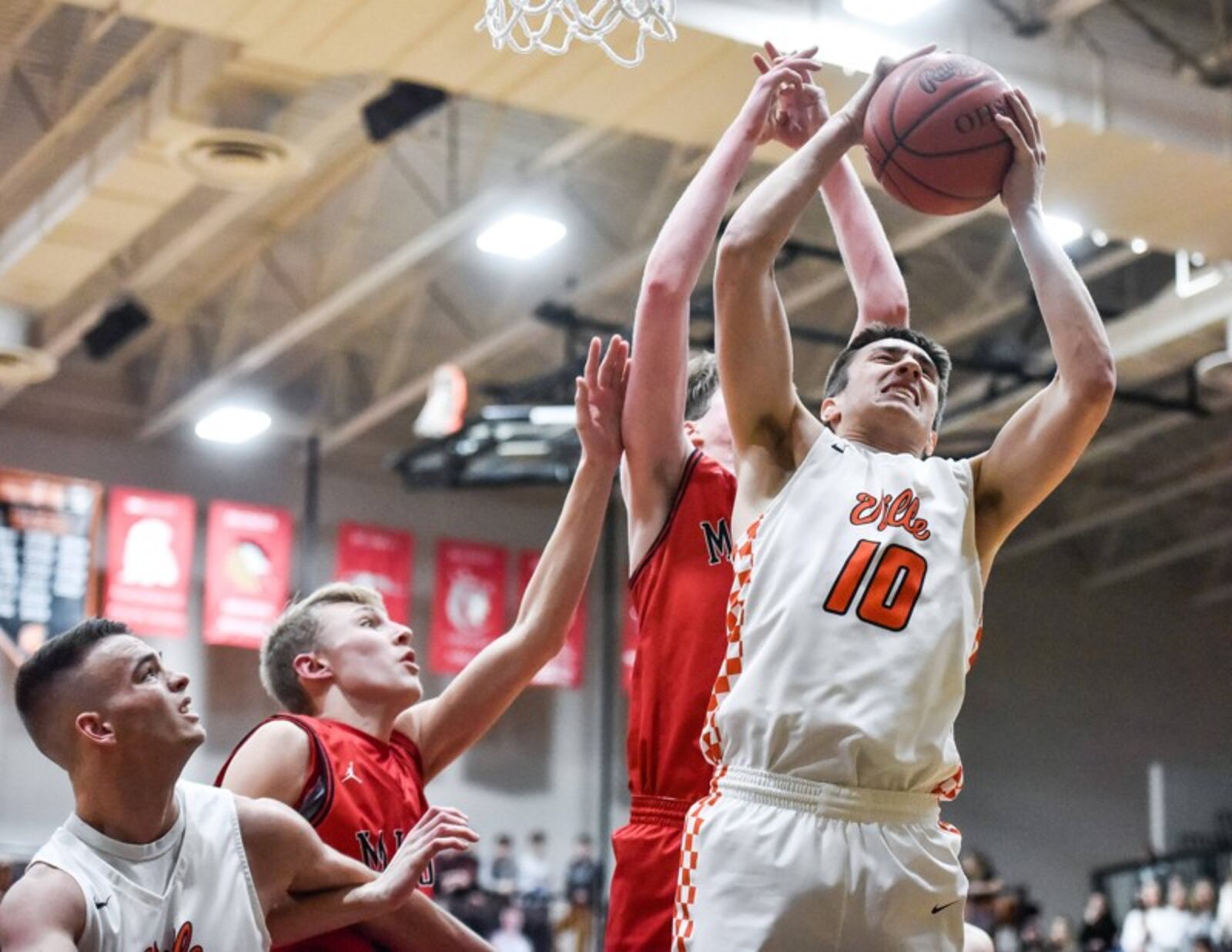 Waynesville's Anthony Carmichael (10) grabs a rebound during Friday night's 59-39 victory over visiting Madison. NICK GRAHAM/STAFF