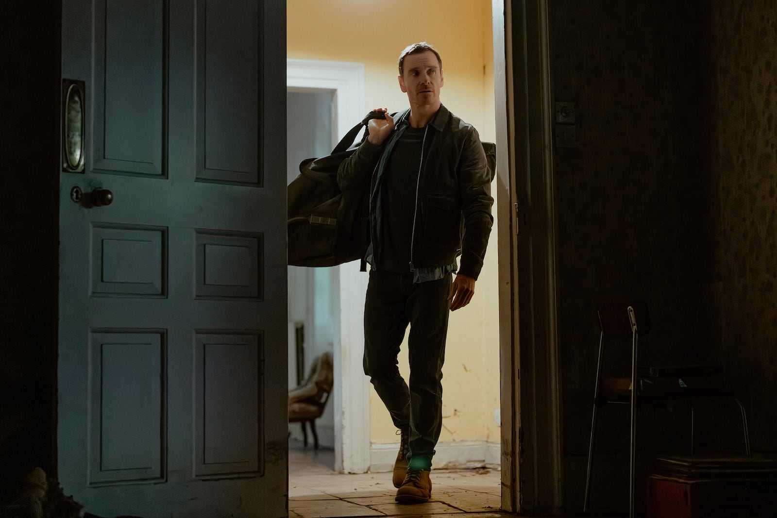 This image released by Paramount+ shows Michael Fassbender in a scene from "The Agency." (Luke Varley/Paramount+ via AP)