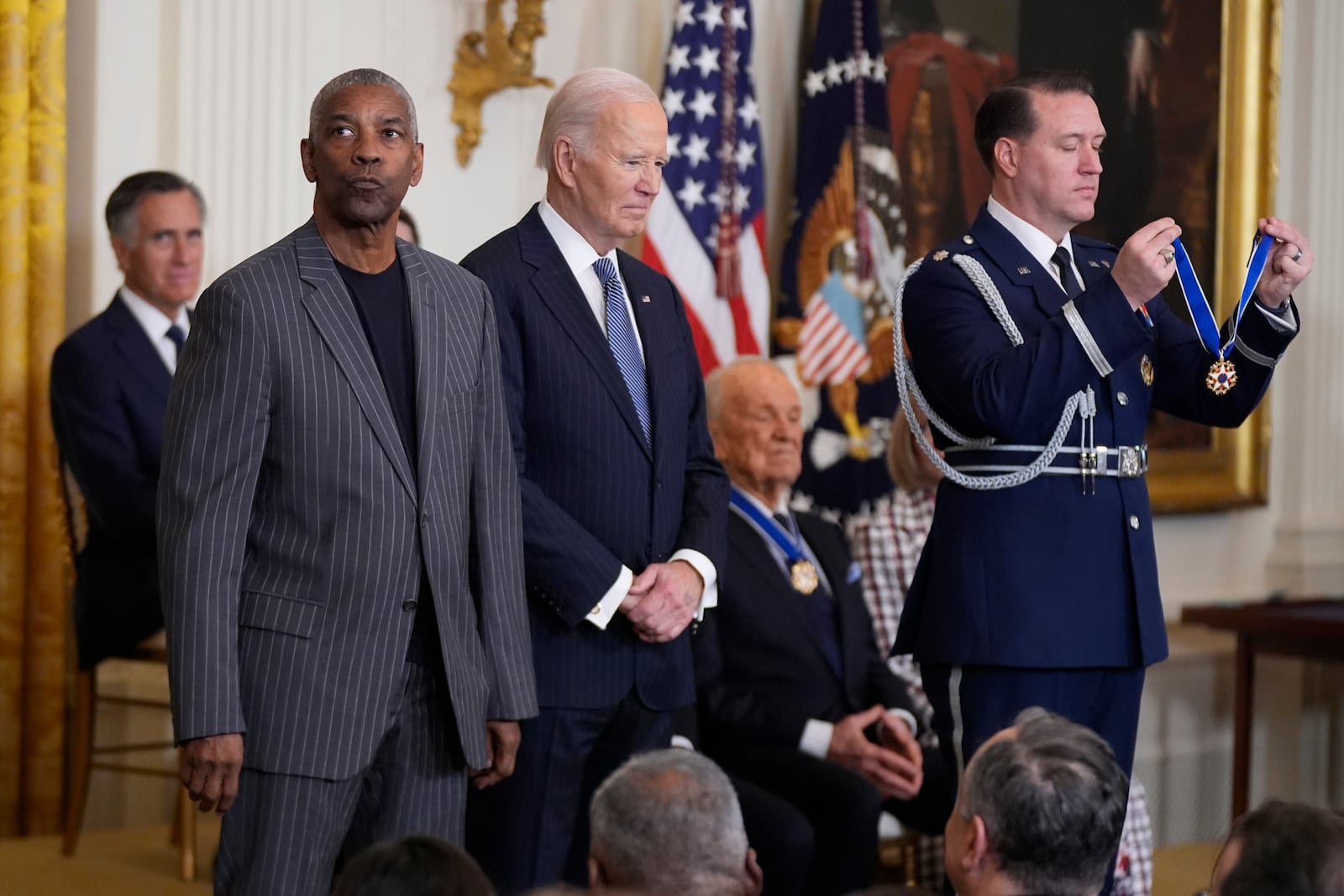 President Joe Biden, center, prepares to present the Presidential Medal of Freedom, the Nation's highest civilian honor, to Denzel Washington in the East Room of the White House, Saturday, Jan. 4, 2025, in Washington. (AP Photo/Manuel Balce Ceneta)