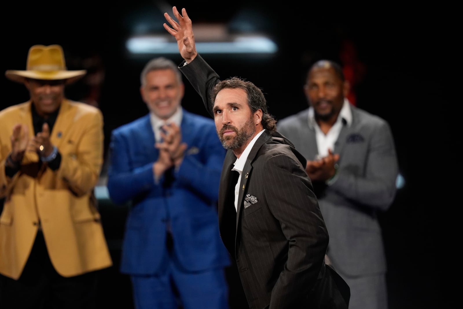 Minnesota Vikings' Jared Allen, former professional football player waves as he is introduced into the NFL Hall of Fame Class of 2025, during the NFL Honors award show ahead of the Super Bowl 59 football game, Thursday, Feb. 6, 2025, in New Orleans. (AP Photo/David J. Phillip)