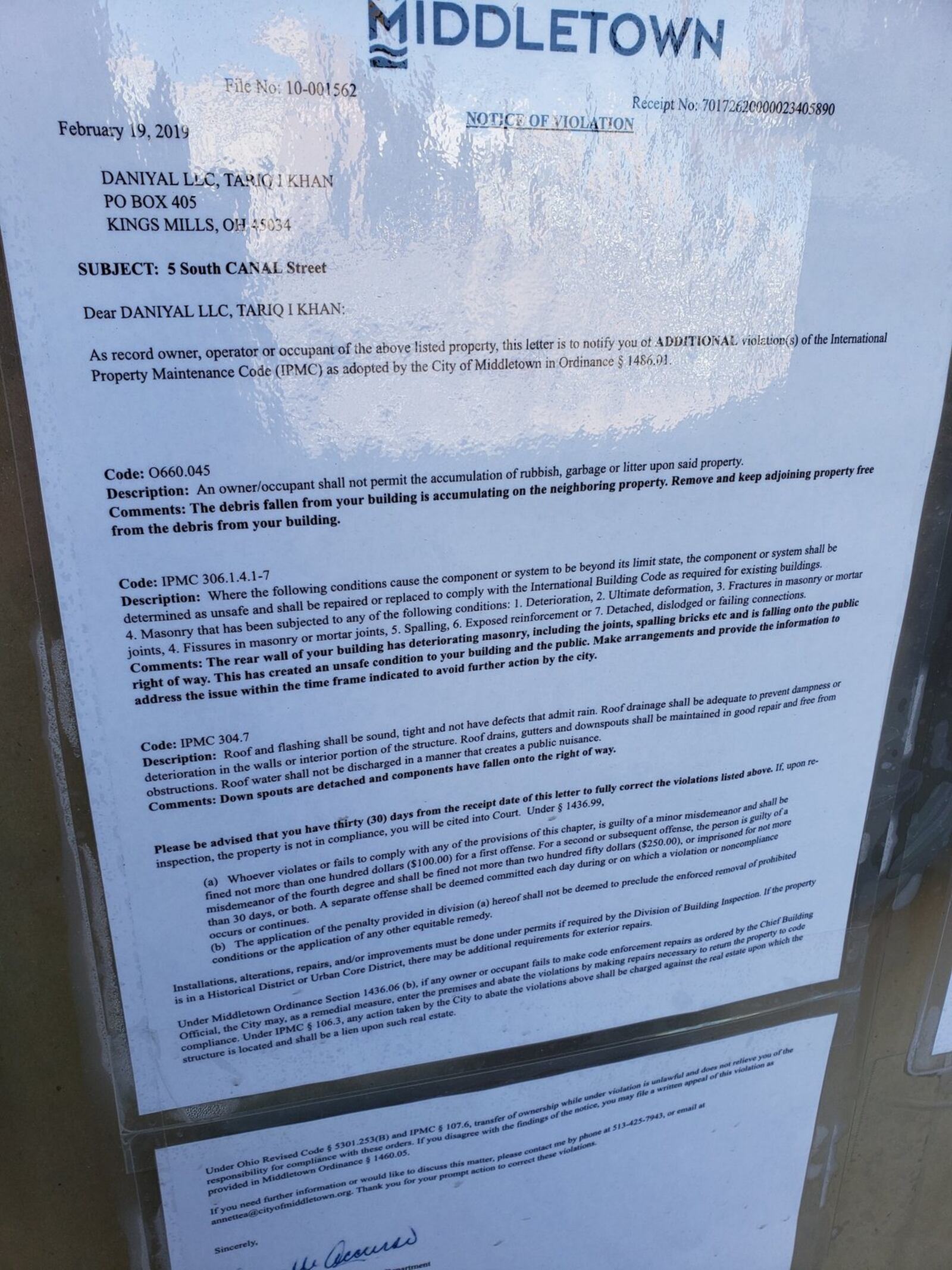 A copy of one of several notices posted at the former Reed-Klopp furniture store, 5 Canal St. in downtown Middletown. NICK GRAHAM/STAFF