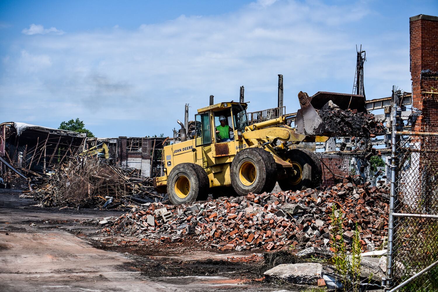 Crews demolish warehouse after massive fire in Hamilton