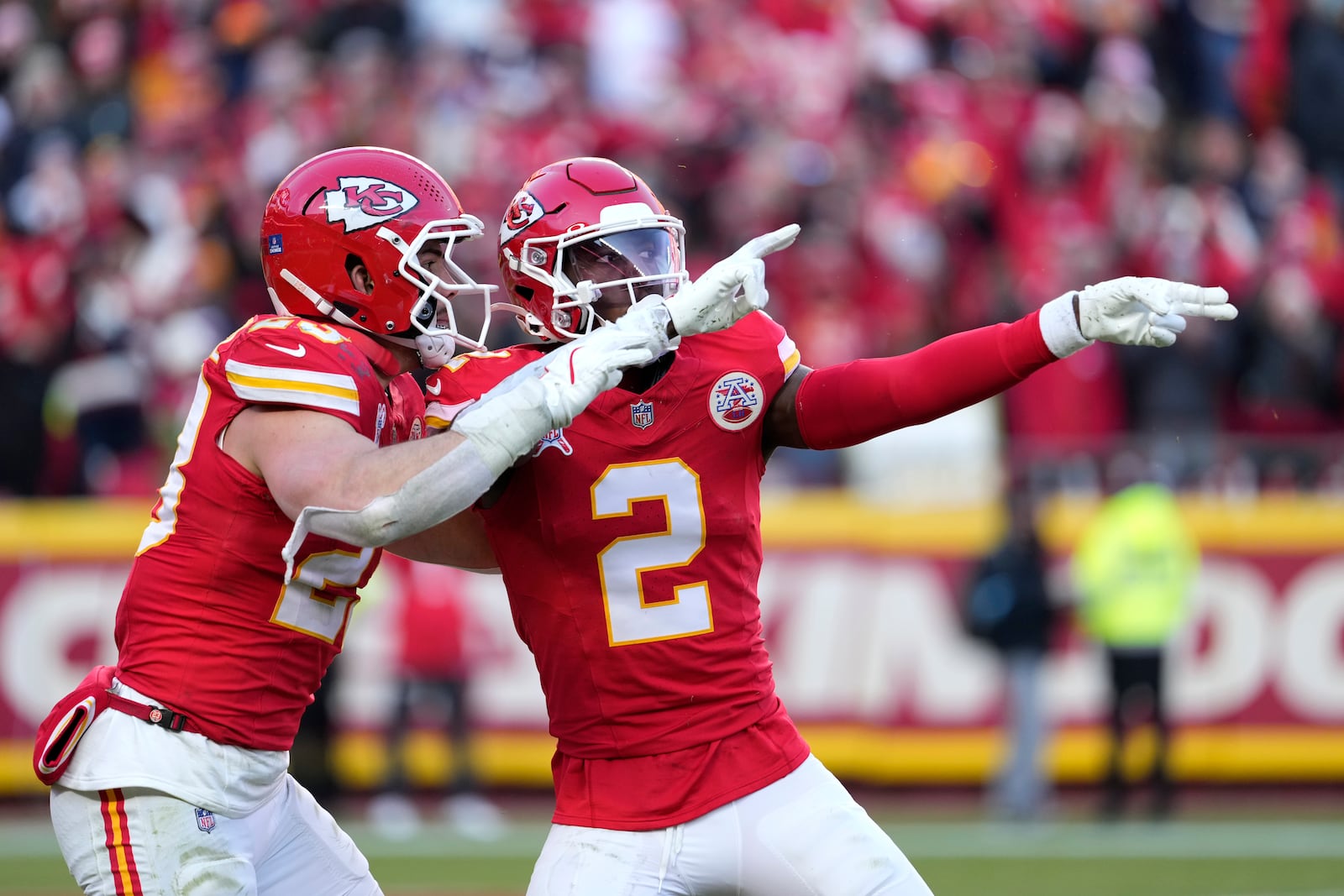 Kansas City Chiefs' Joshua Williams (2) is congratulated by teammate Drue Tranquill after sacking Houston Texans quarterback C.J. Stroud for a 12-yard loss during the second half of an NFL football game Saturday, Dec. 21, 2024, in Kansas City, Mo. (AP Photo/Ed Zurga)