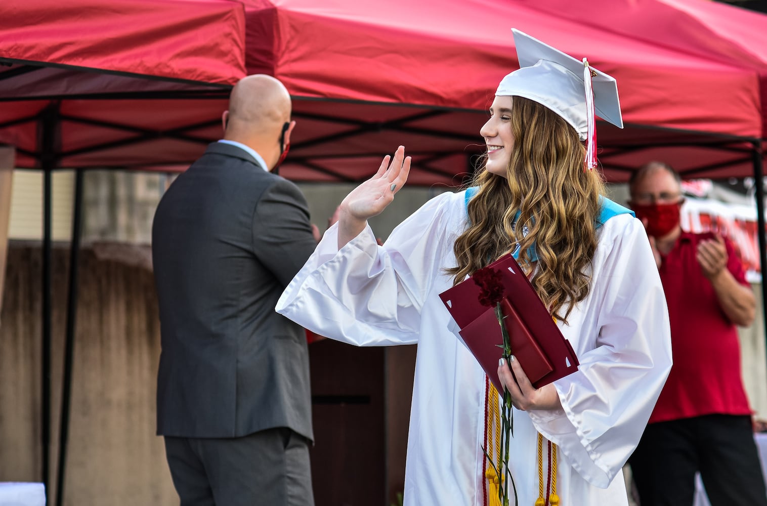 Madison High School drive-thru graduation ceremony at Land of Illusion