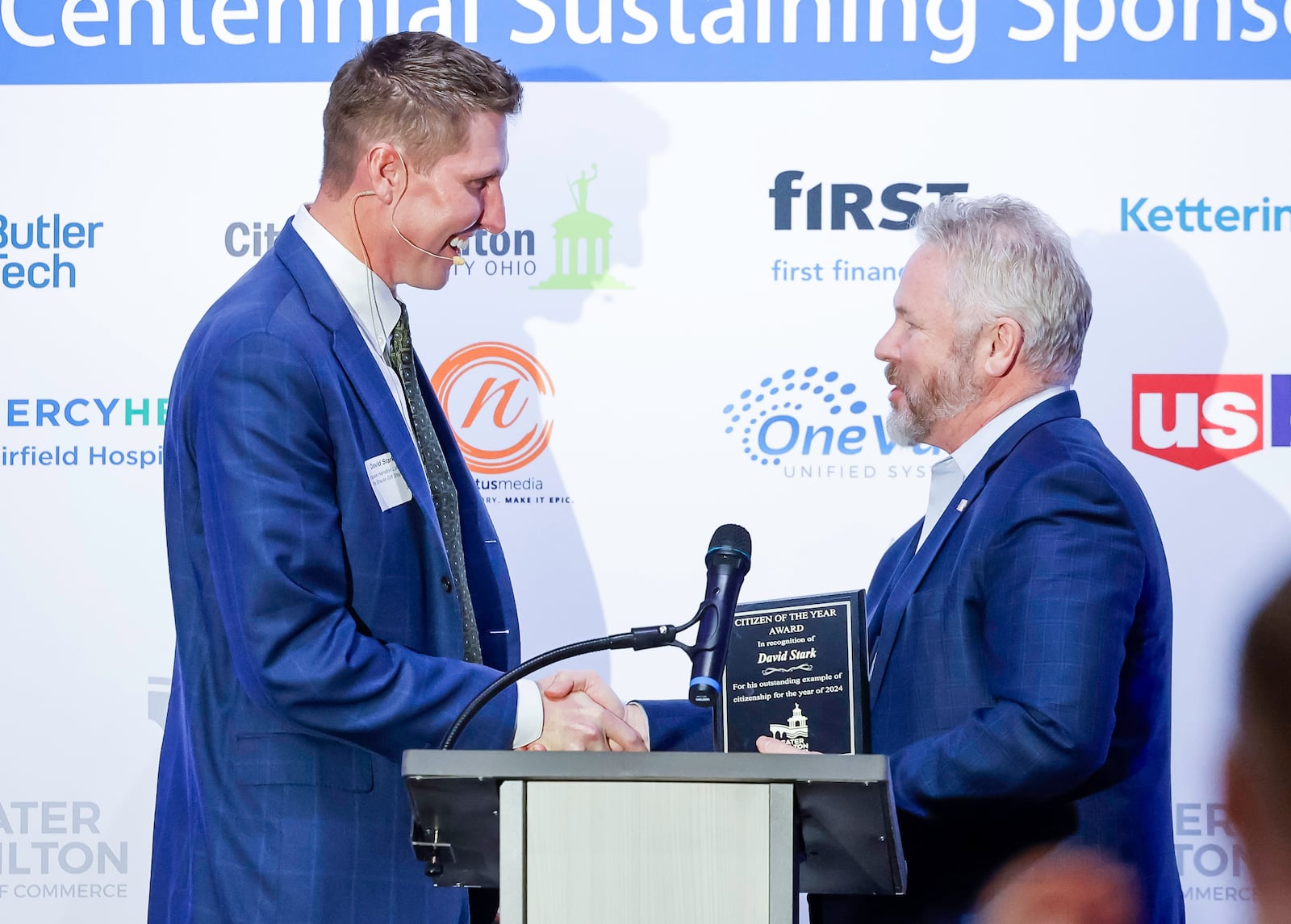 Congressman Warren Davidson, right, presents David Stark with Citizen of the Year award during the Greater Hamilton Chamber of Commerce annual meeting Friday, Jan. 31, 2025 at Spooky Nook Sports Champion Mill in Hamilton. David Stark was honored as Hamilton Citizen of the Year and Kirsten Spicer was honored as Small Business Person of the Year. NICK GRAHAM/STAFFNICK GRAHAM/STAFF