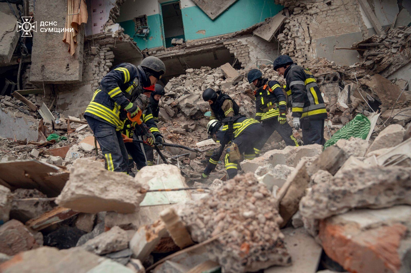 In this photo provided by the Ukrainian Emergency Services on Nov. 19, 2024, rescue workers clear the rubble of a residential building destroyed by a Russian strike in Hlukhiv, Ukraine. (Ukrainian Emergency Service via AP)