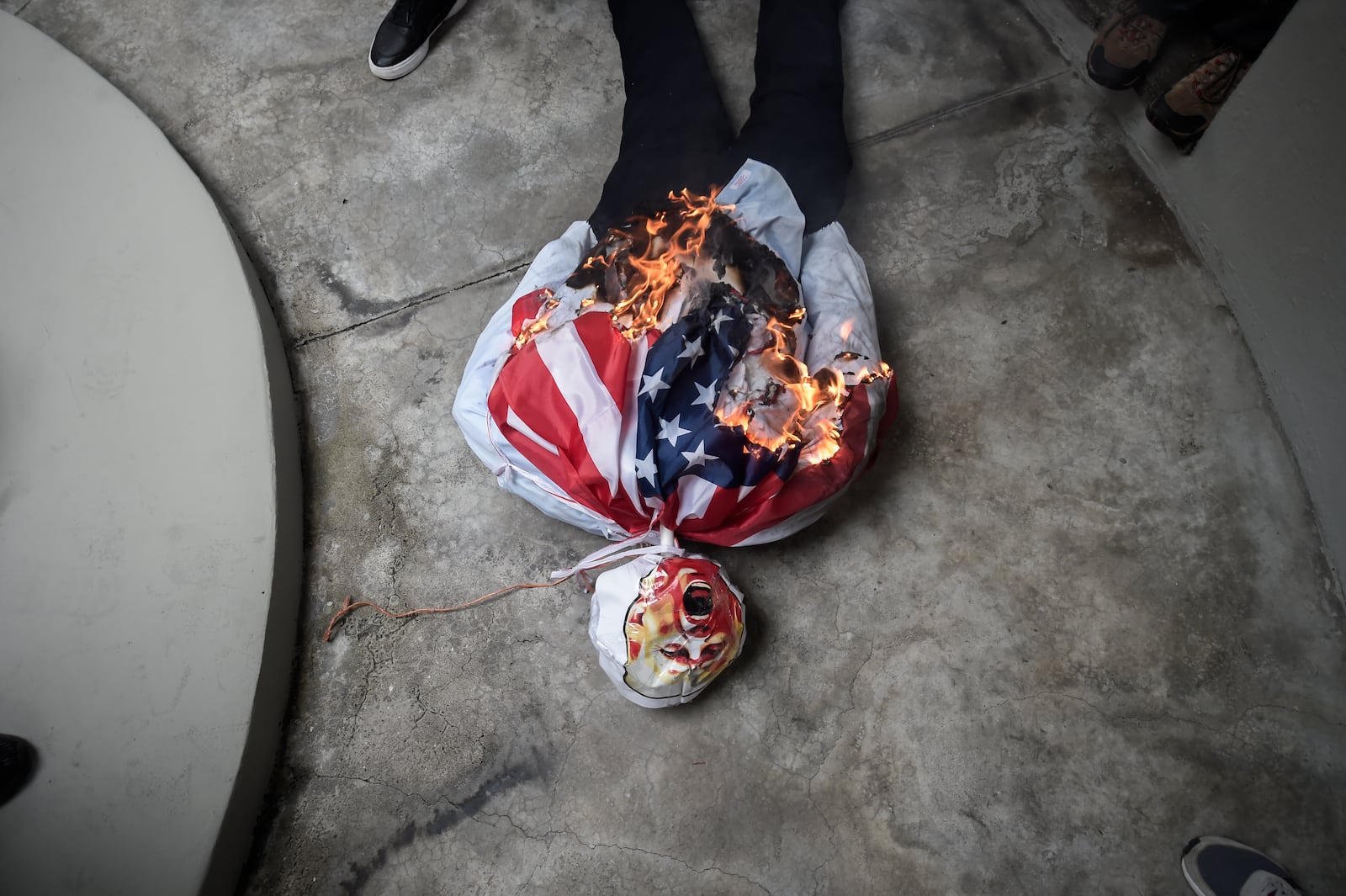 An effigy of President-elect Donald Trump is set on fire during a demonstration marking Martyrs' Day, a national day of mourning to honor the 21 Panamanians who were killed during the January 1964 anti-American riots over sovereignty of the Panama Canal Zone, in Panama City, Thursday, Jan. 9, 2025. (AP Photo/Agustin Herrera)