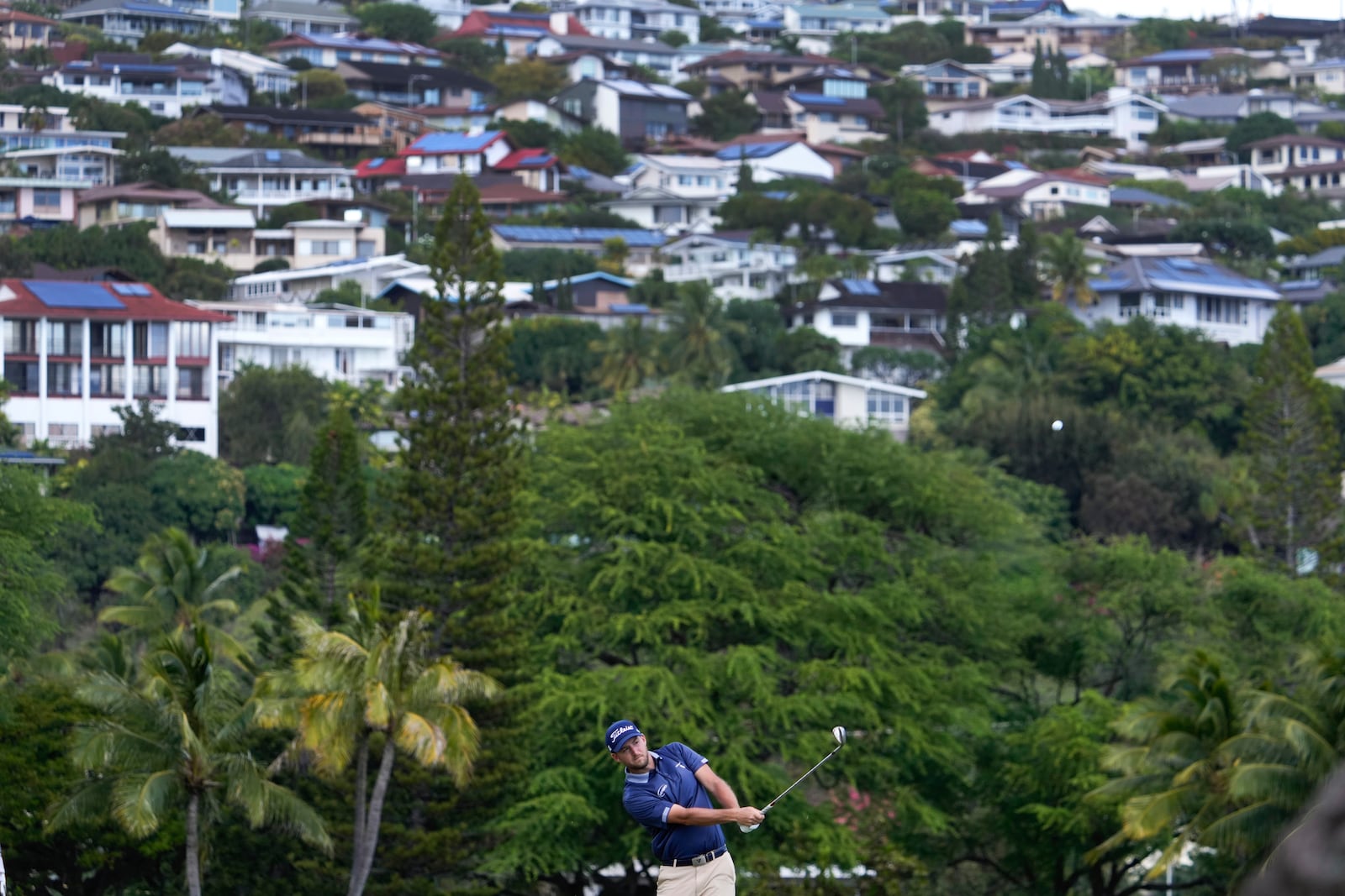 Lee Hodges chips on the 16th fairway during the third round of the Sony Open golf tournament, Saturday, Jan. 11, 2025, at Waialae Country Club in Honolulu. (AP Photo/Matt York)