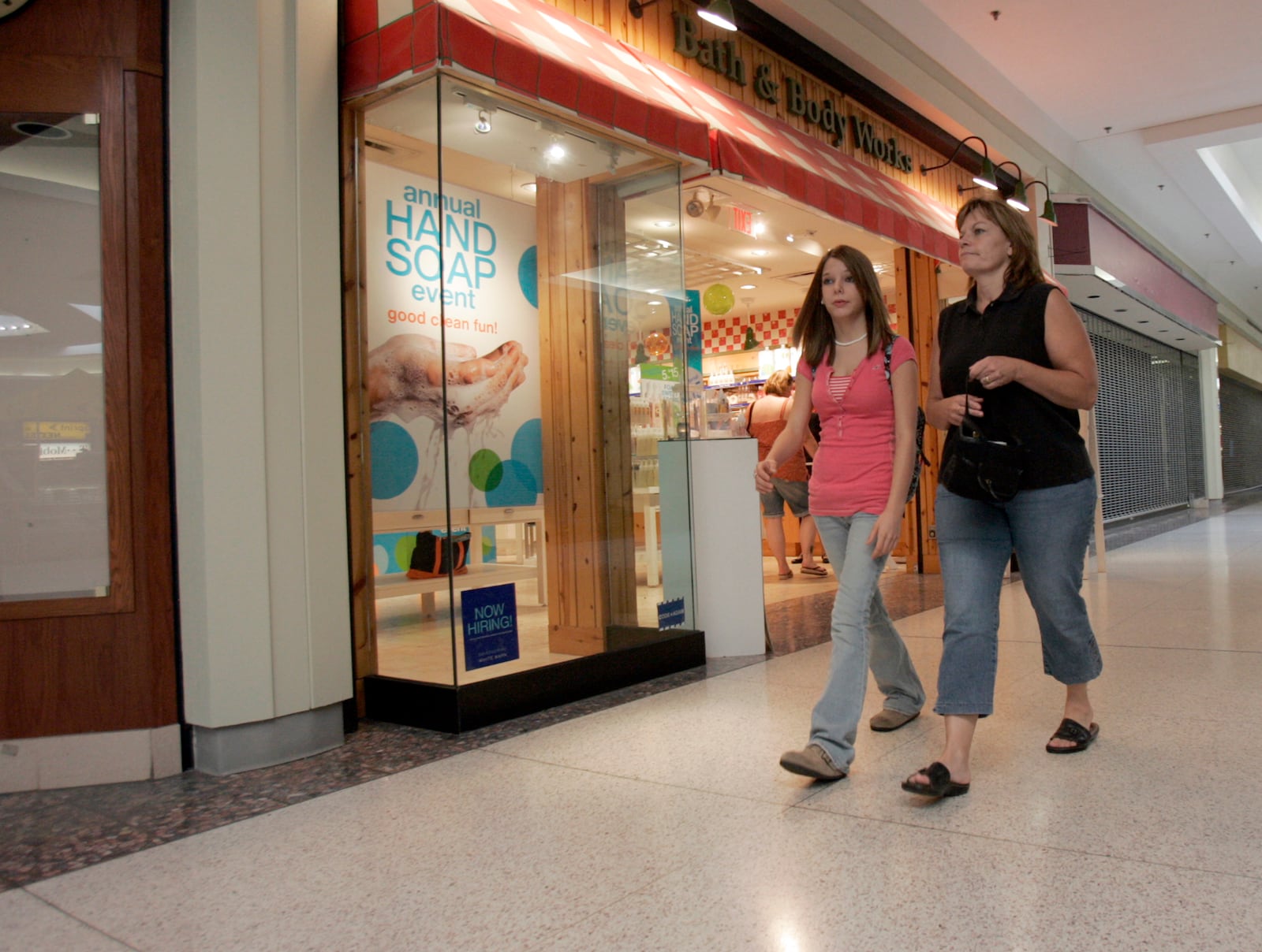 Michelle Monk, right, of the Big Brothers Big Sisters organization with her "little sister" Megan Brashear, 14, walk the halls of Towne Mall while doing some back to school shopping Tuesday Aug. 28, 2007. Monk has been Megan's "big sister" for about five and a half years. Staff photo by Pat Auckerman