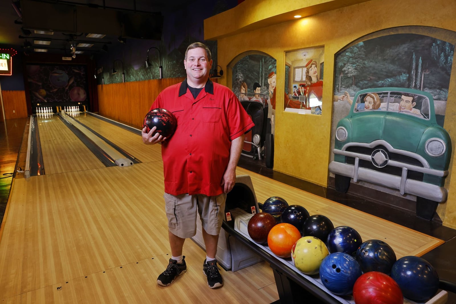 Butler County Common Pleas Court Judge Dan Haughey is an avid bowler in his off time and spends time with family and friends in his home bowling alley. NICK GRAHAM/STAFF