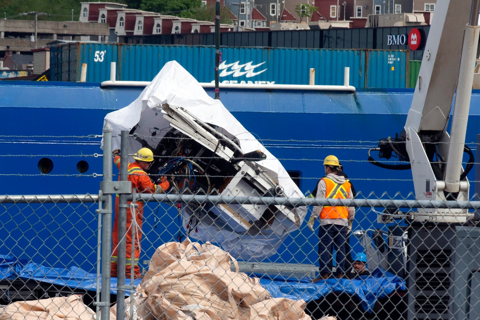 FILE - Debris from the Titan submersible, recovered from the ocean floor near the wreck of the Titanic, is unloaded from the ship Horizon Arctic at the Canadian Coast Guard pier in St. John's, Newfoundland, Wednesday, June 28, 2023. (Paul Daly/The Canadian Press via AP, File)