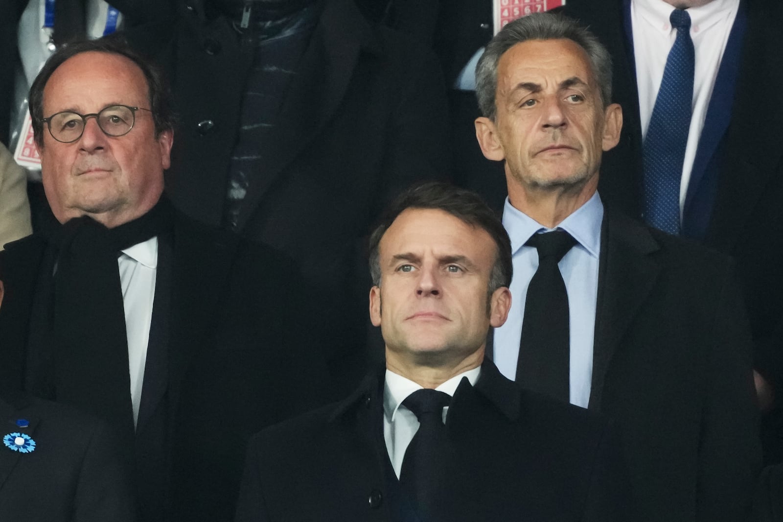 French President Emmanuel Macron, centre, and Former French Presidents Nicolas Sarkozy, right, and Francois Hollande wait for the start of the UEFA Nations League soccer match between France and Israel at the Stade de France stadium in Saint-Denis, outside Paris, Thursday Nov. 14, 2024. (AP Photo/Thibault Camus)