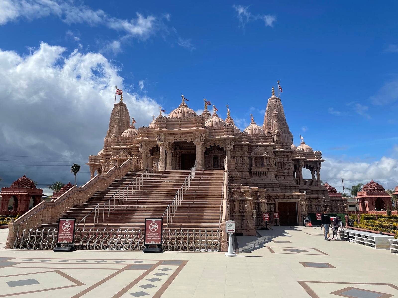 Visitors walk in front of the BAPS Shri Swaminarayan Mandir, the largest Hindu temple in California, on March 13, 2025. (AP Photo/Deepa Bharath)