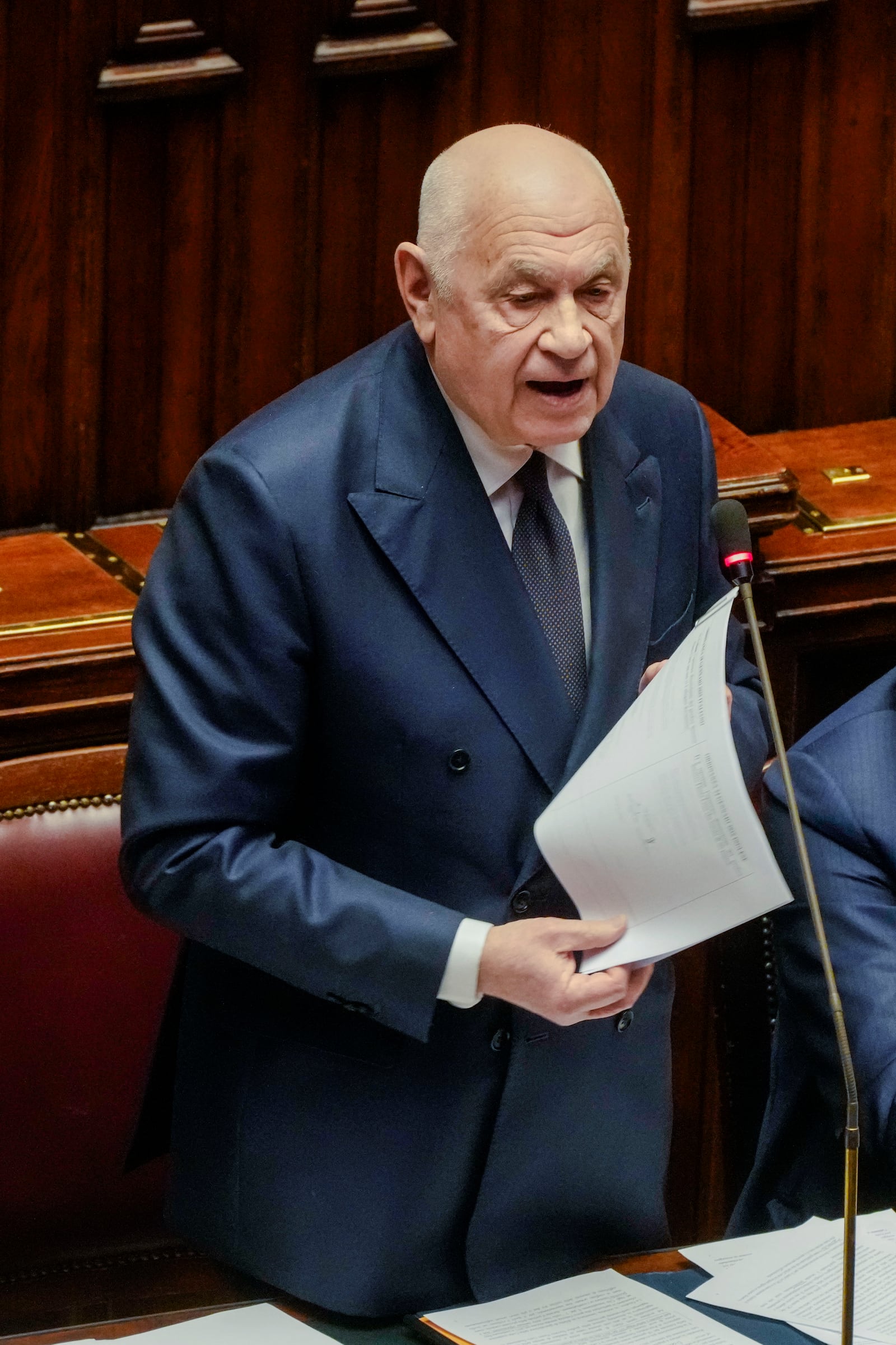 Italian Justice Minister Carlo Nordio speaks in the lower Chamber in Rome, Wednesday, Feb. 5, 2025, after receiving a warrant for repatriating a Libyan warlord, Ossama Anjiem, also known as Ossama al-Masri, wanted by the International Criminal Court in the Hague and who had been arrested in Turin, northern Italy. (AP Photo/Gregorio Borgia)