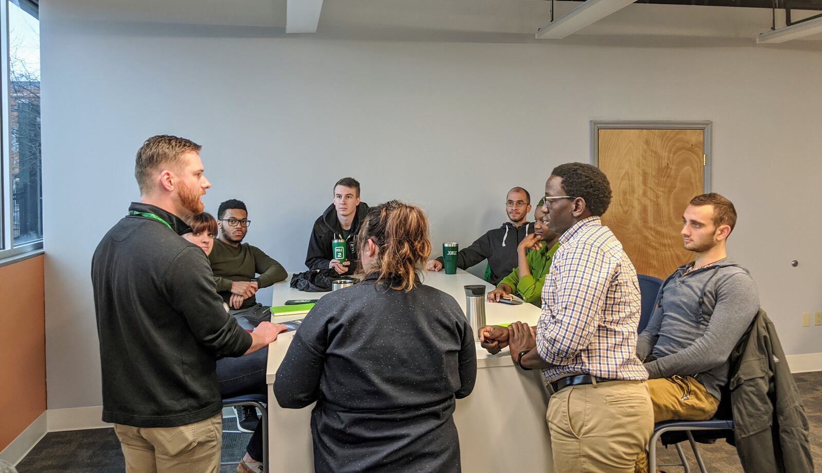 Mile Two employees collaborate at the Dayton systems engineering company.