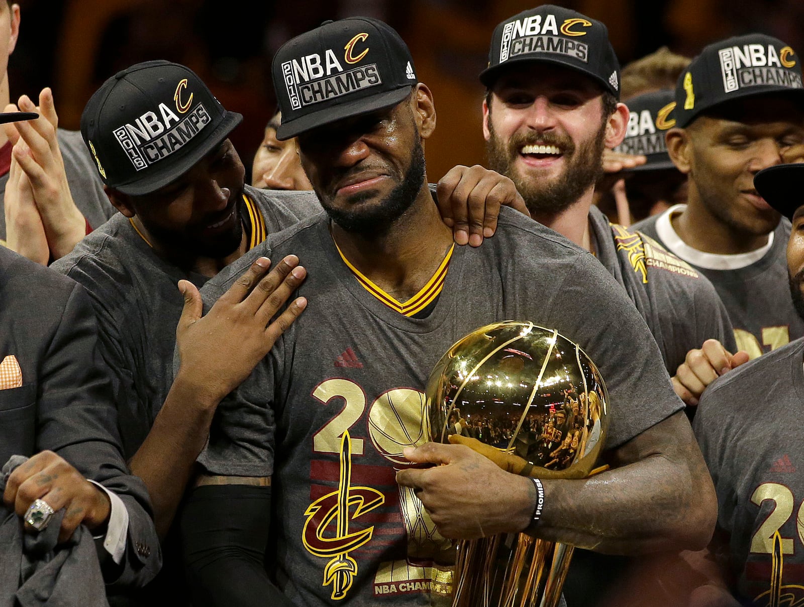 FILE -Cleveland Cavaliers forward LeBron James, center, celebrates with teammates after Game 7 of basketball's NBA Finals against the Golden State Warriors in Oakland, Calif., Sunday, June 19, 2016. LeBron James is about to pass Kareem Abdul-Jabbar as the NBA's career scoring leader. The AP is looking back at some of his top games along the way. (AP Photo/Marcio Jose Sanchez, File)