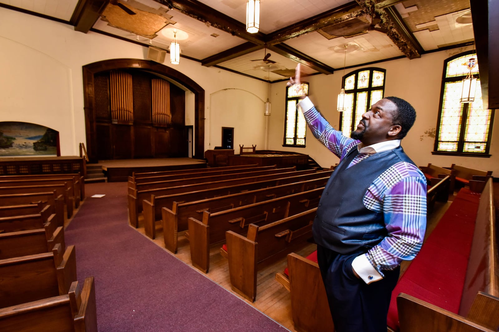 Frederick McQueen, pastor of The Sanctuary Covenant Christian Fellowship church on Park Avenue in Hamilton, is trying to secure funding to restore the original building of their church built in 1919. NICK GRAHAM/STAFF