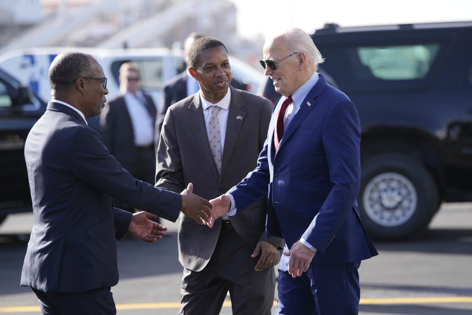 President Joe Biden is greeted by Cape Verde's Prime Minister Ulisses Correia e Silva at Amilcar Cabral international airport on Sal island, Cape Verde Monday, Dec. 2, 2024, en route to Angola as he makes his long-promised visit to Africa. (AP Photo/Ben Curtis)