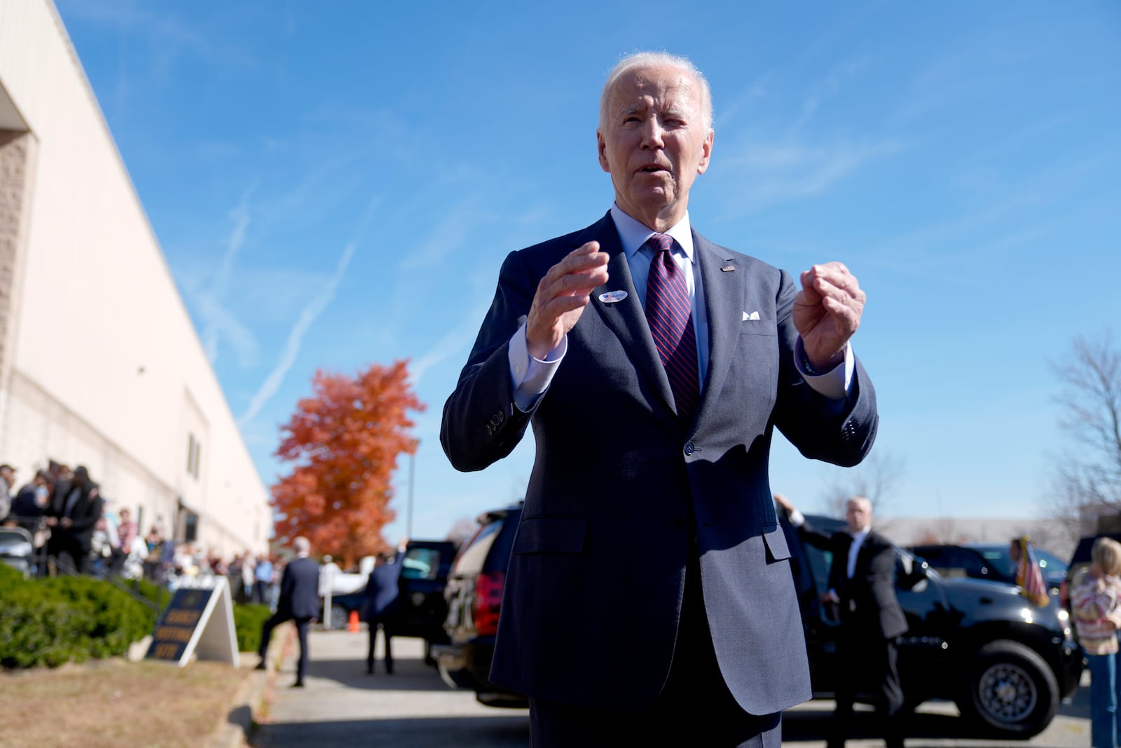 President Joe Biden speaks with reporters after casting his early-voting ballot for the 2024 general elections, Monday, Oct. 28, 2024, at a polling station in New Castle, Del. (AP Photo/Manuel Balce Ceneta)