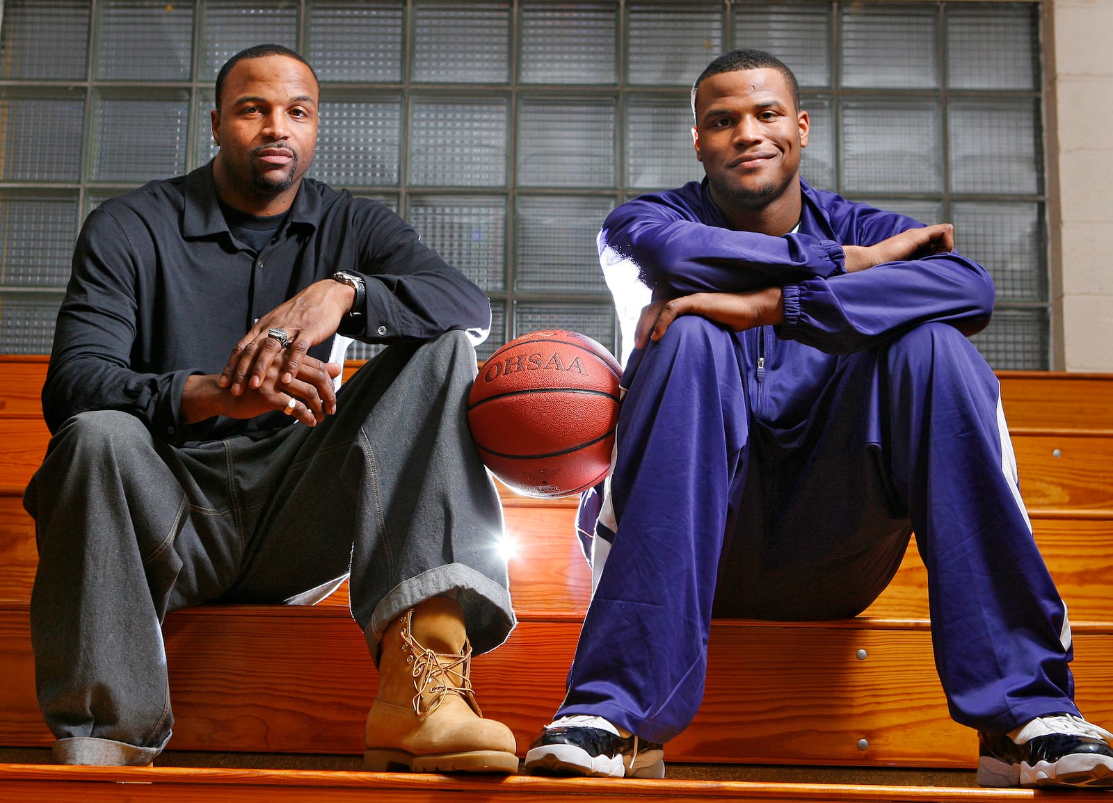 Bill Edwards, a former Wright State University basketball player, sits with his son, Bill Edwards, Jr, a senior Middletown Middie basketball player, at Wade E. Miller Gymnasium in Middletown in 2009. Nick Graham/STAFF