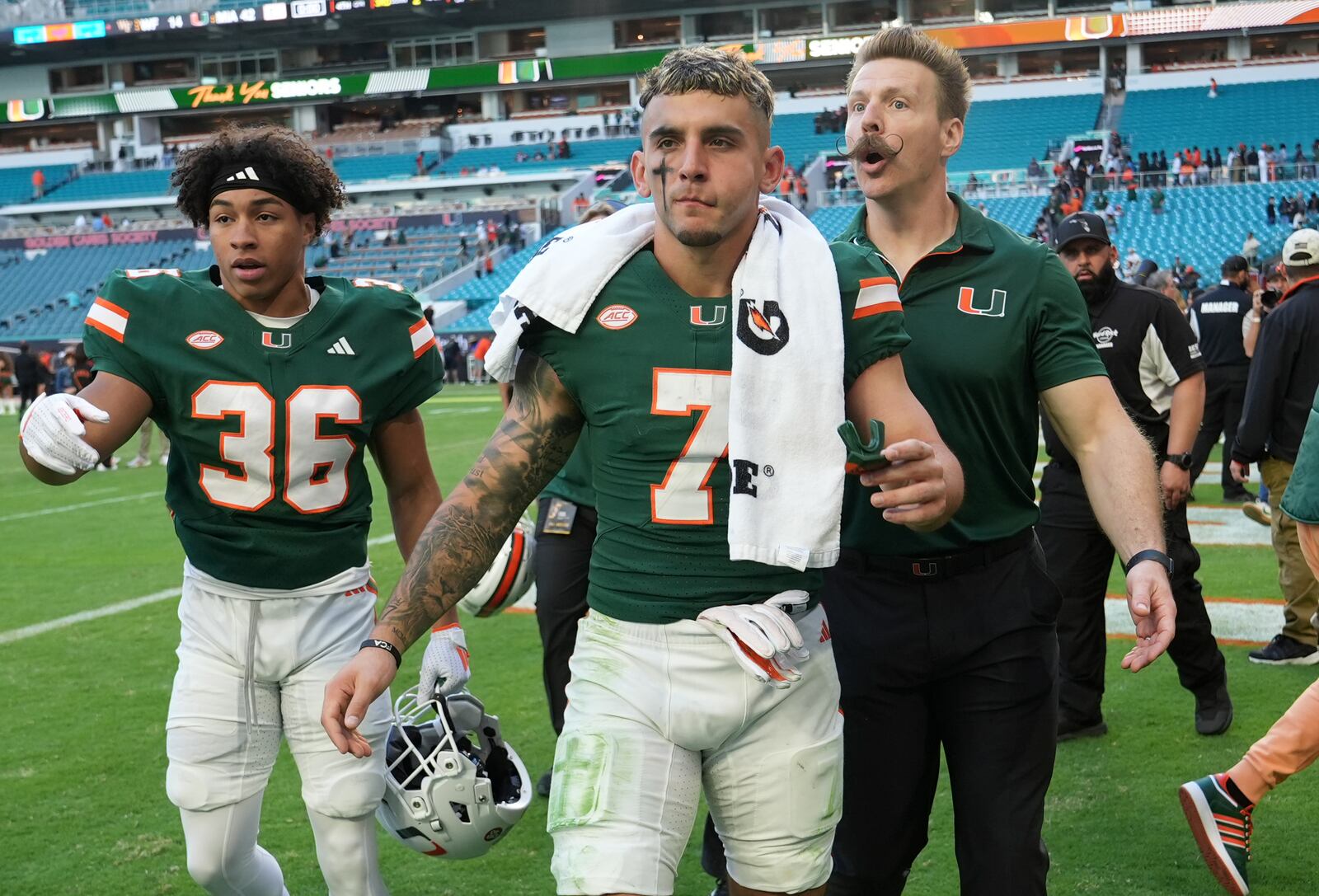 Miami wide receiver Xavier Restrepo (7) walks off the field after an NCAA college football game against Wake Forest, Saturday, Nov. 23, 2024, in Miami Gardens, Fla. (AP Photo/Lynne Sladky)