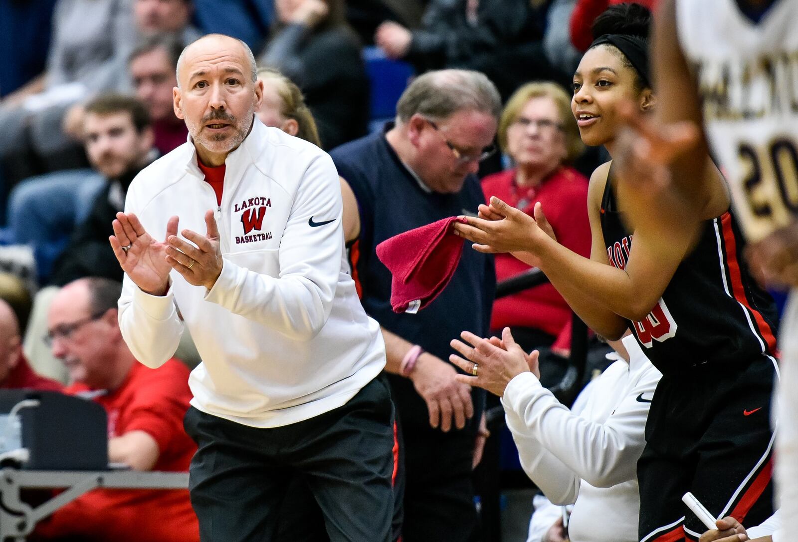 Lakota West coach Andy Fishman cheers for his team during a Division I regional semifinal against Walnut Hills on March 7, 2018, at Fairmont’s Trent Arena. NICK GRAHAM/STAFF