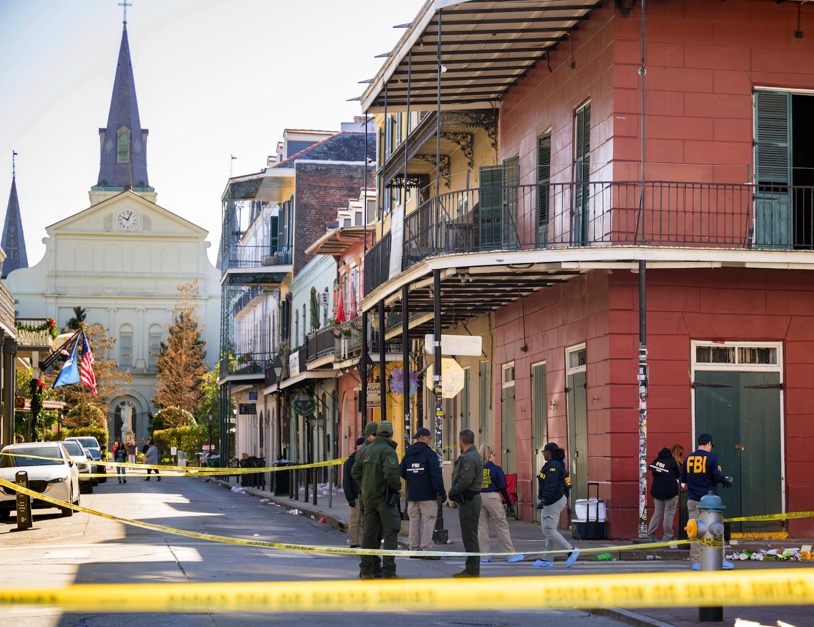 FILE - The FBI investigates the area on Orleans Street and Bourbon Street by St. Louis Cathedral in the French Quarter where a suspicious package was detonated after a person drove a truck into a crowd earlier on Bourbon Street on Wednesday, Jan. 1, 2025. (AP Photo/Matthew Hinton, File)