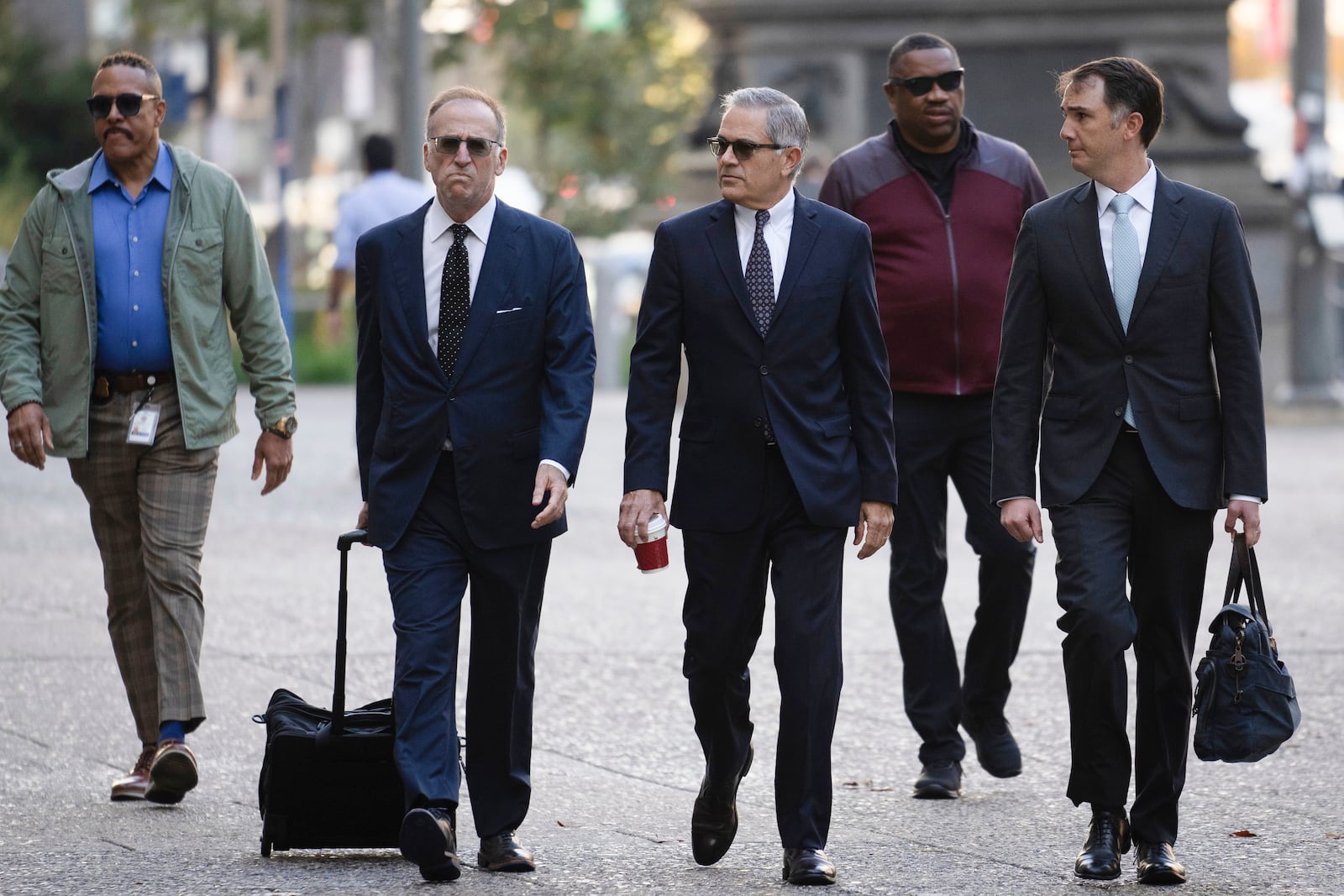 Philadelphia District Attorney Larry Krasner, third from right, arrives for a hearing at a City Hall courtroom, Thursday, Oct. 31, 2024, in Philadelphia. (AP Photo/Matt Rourke)