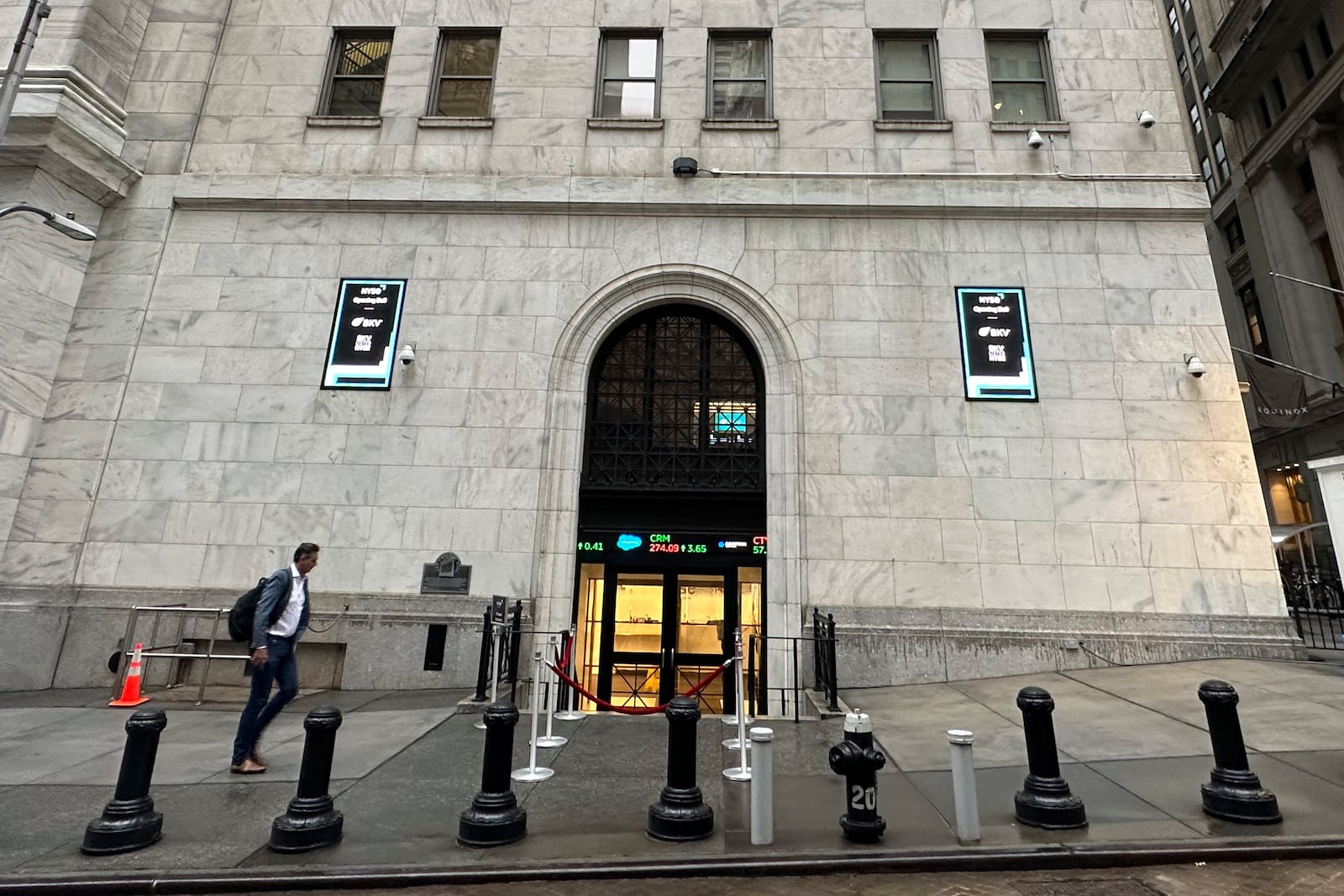 FILE - A man approaches an entrance to the New York Stock Exchange on Sept. 26, 2024, in New York. (AP Photo/Peter Morgan, File)