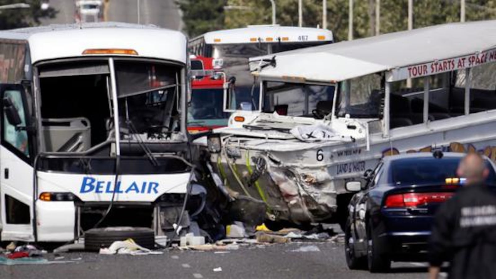 A charter bus, left, and an amphibious Ride the Ducks tour vehicle collided on the Aurora Bridge in downtown Seattle on Thursday, Sept. 24, 2015.