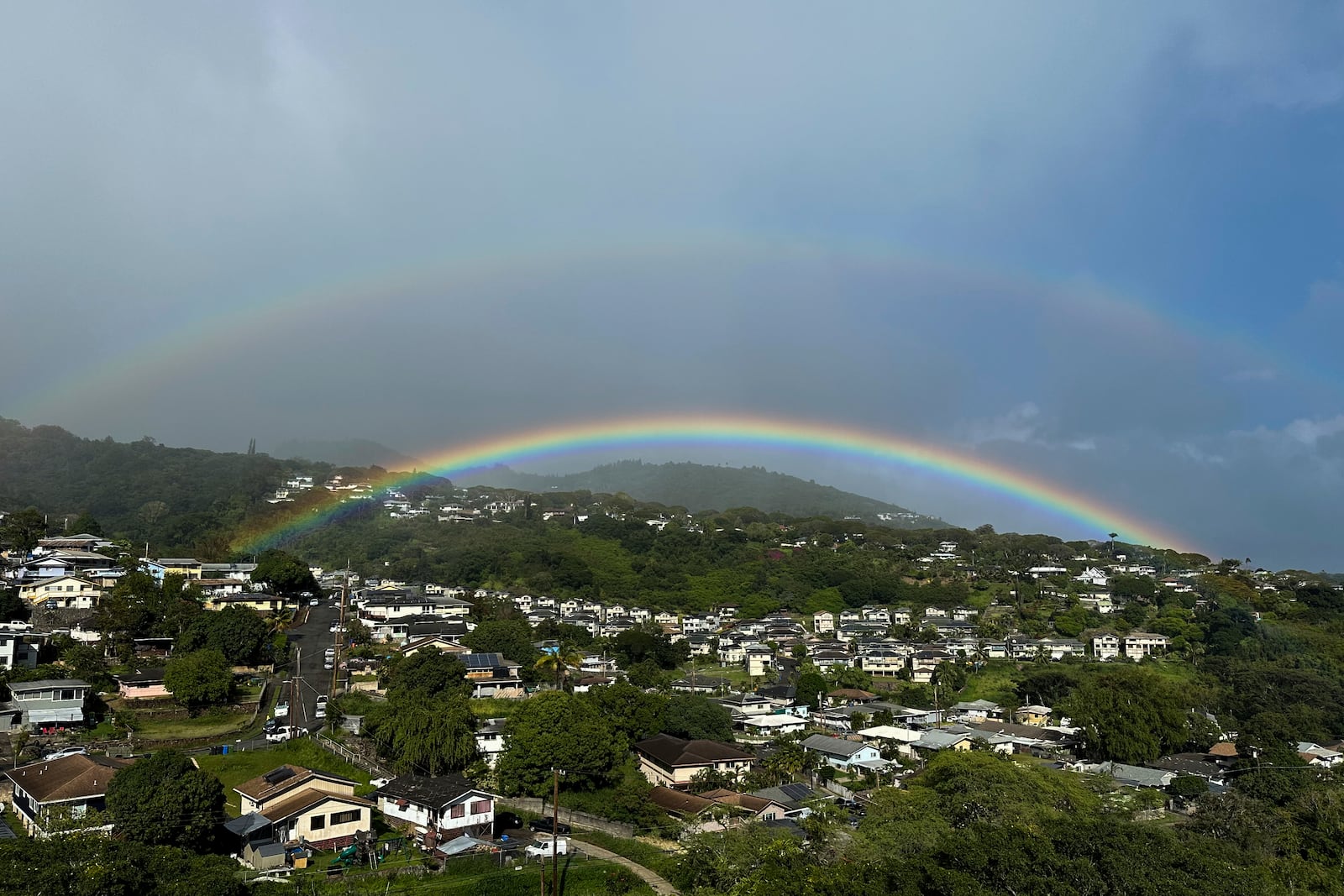 Two rainbows are seen in the sky on April 24, 2024, in Honolulu. (AP Photo/Audrey McAvoy)