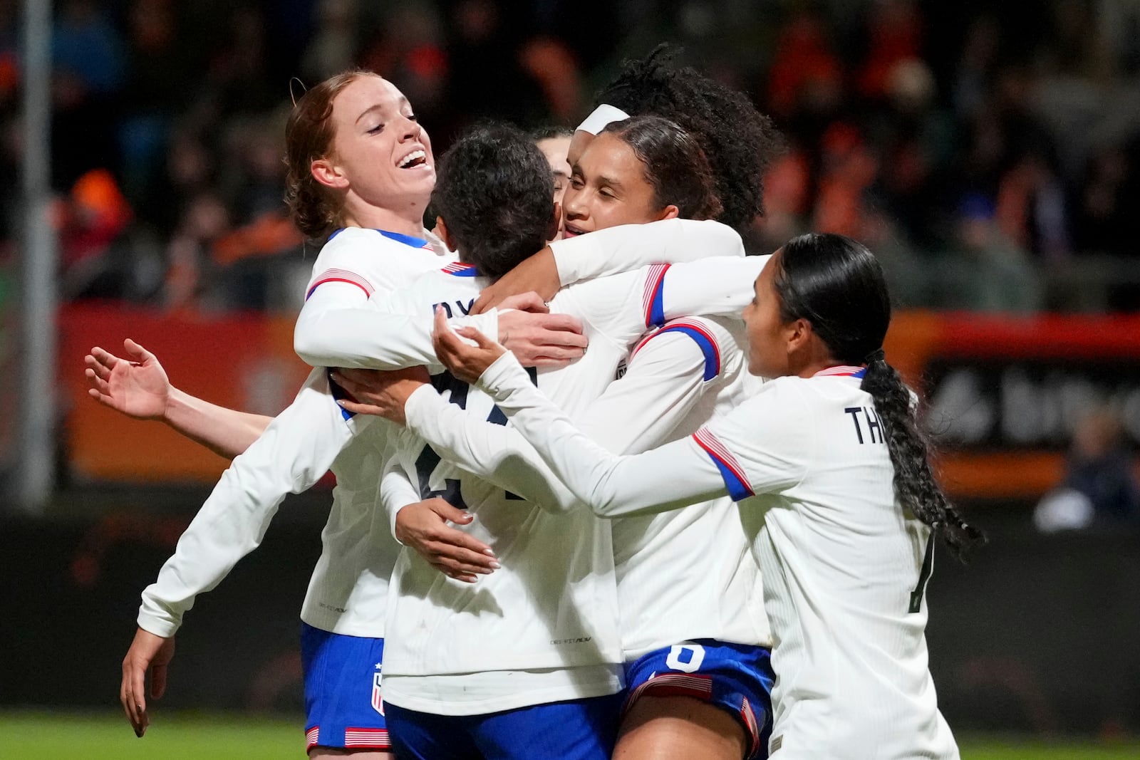 United States' Lynn Williams, center, celebrates after scoring her side's second goal during the international friendly women's soccer match between the Netherlands and the United States at the ADO Den Haag Stadium in The Hague, Netherlands, Tuesday, Dec. 3, 2024. (AP Photo/Peter Dejong)