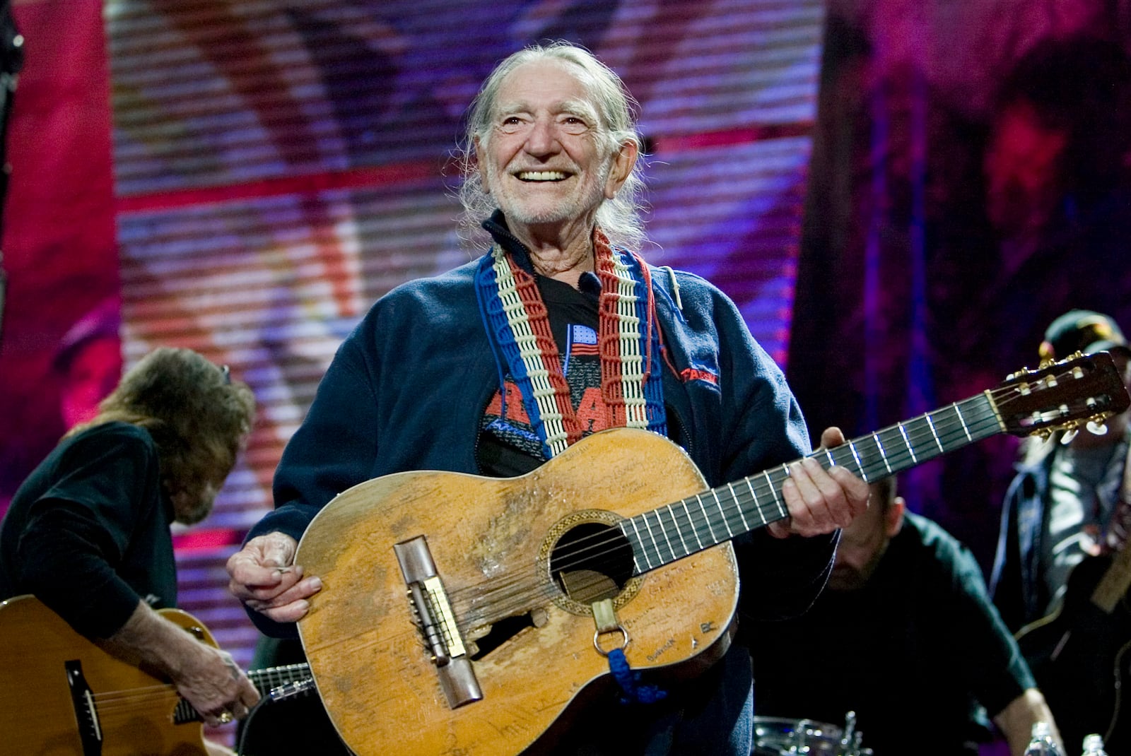 FILE - Willie Nelson entertains the audience while performing at the Farm Aid Concert in Camden, N.J. on Saturday, Sept. 30, 2006. (AP Photo/Tim Larsen, File)