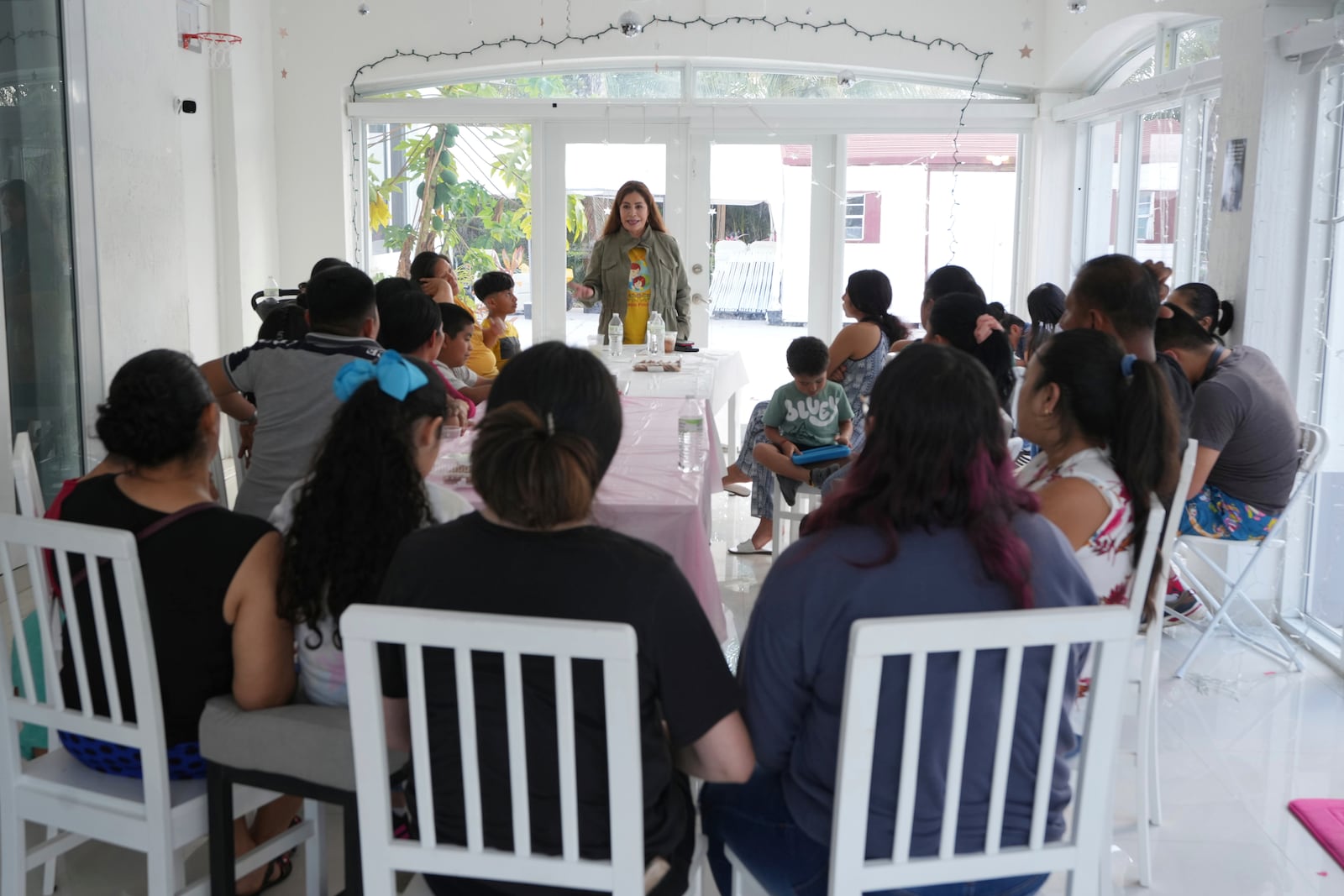 Nora Sandigo speaks to immigrant families with small children Sunday, Jan. 19, 2025, in Miami. Sandigo is the legal guardian to more than 2,000 U.S.-born children of immigrant parents. (AP Photo/Marta Lavandier, file)