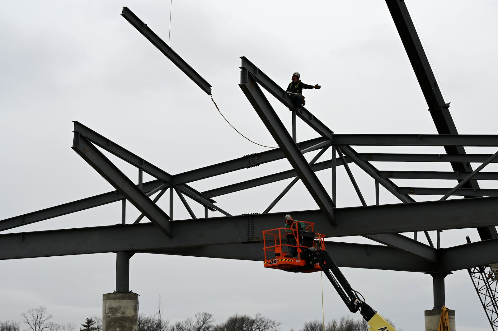 The renovation of the stage at the RiversEdge concert venue at Marcum Park is progressing. The concert season begins this spring and the 2025 lineup is expected to be announced within the next few months. Pictured are construction workers at the RiversEdge project on Tuesday, Feb. 11, 2025. MICHAEL D. PITMAN/STAFF