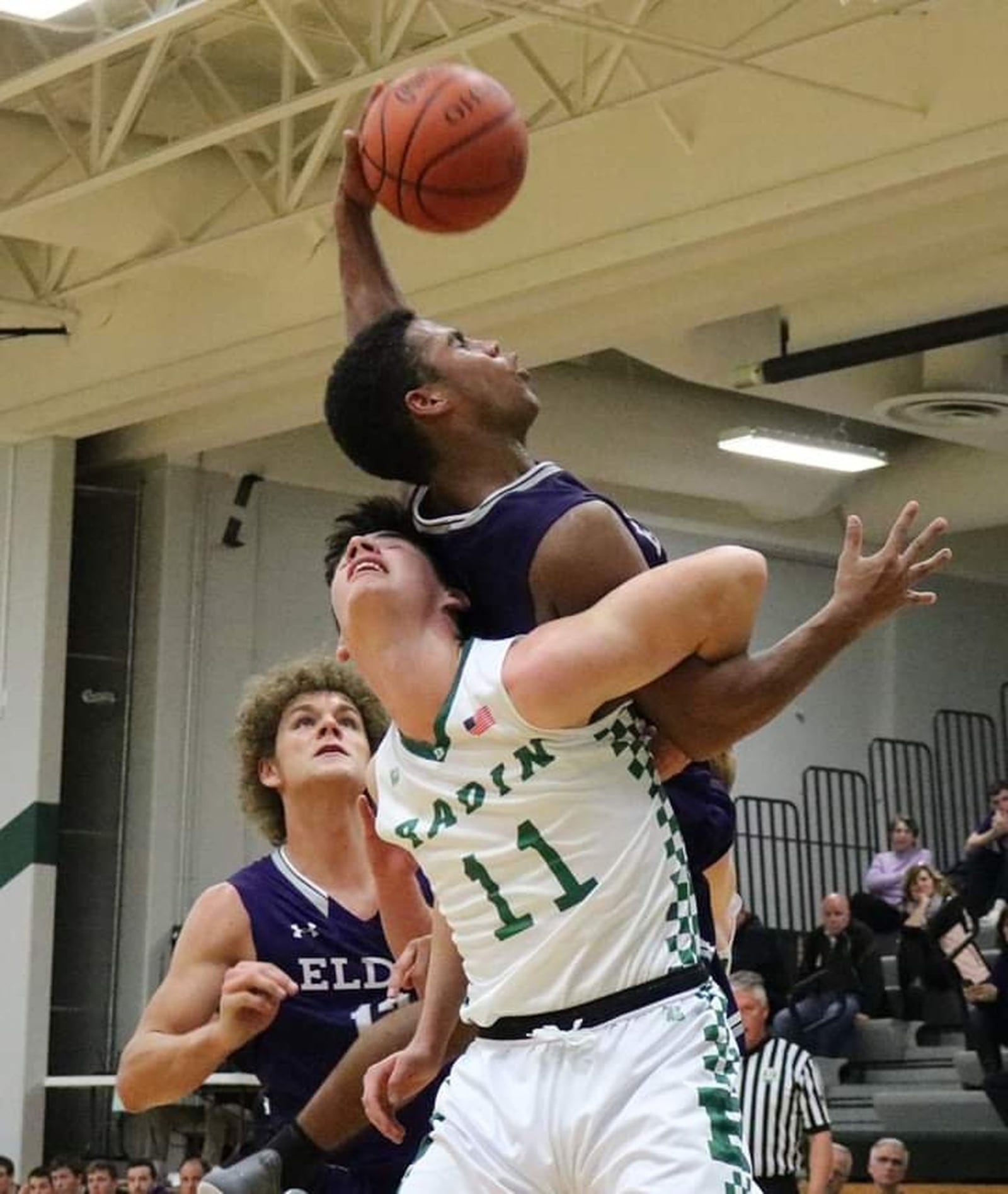 Badin’s Spencer Giesting (11) gets tangled up with Elder’s Bryson Merz during Tuesday night’s game at Mulcahey Gym in Hamilton. Badin picked up a 57-53 win. CONTRIBUTED PHOTO BY TERRI ADAMS