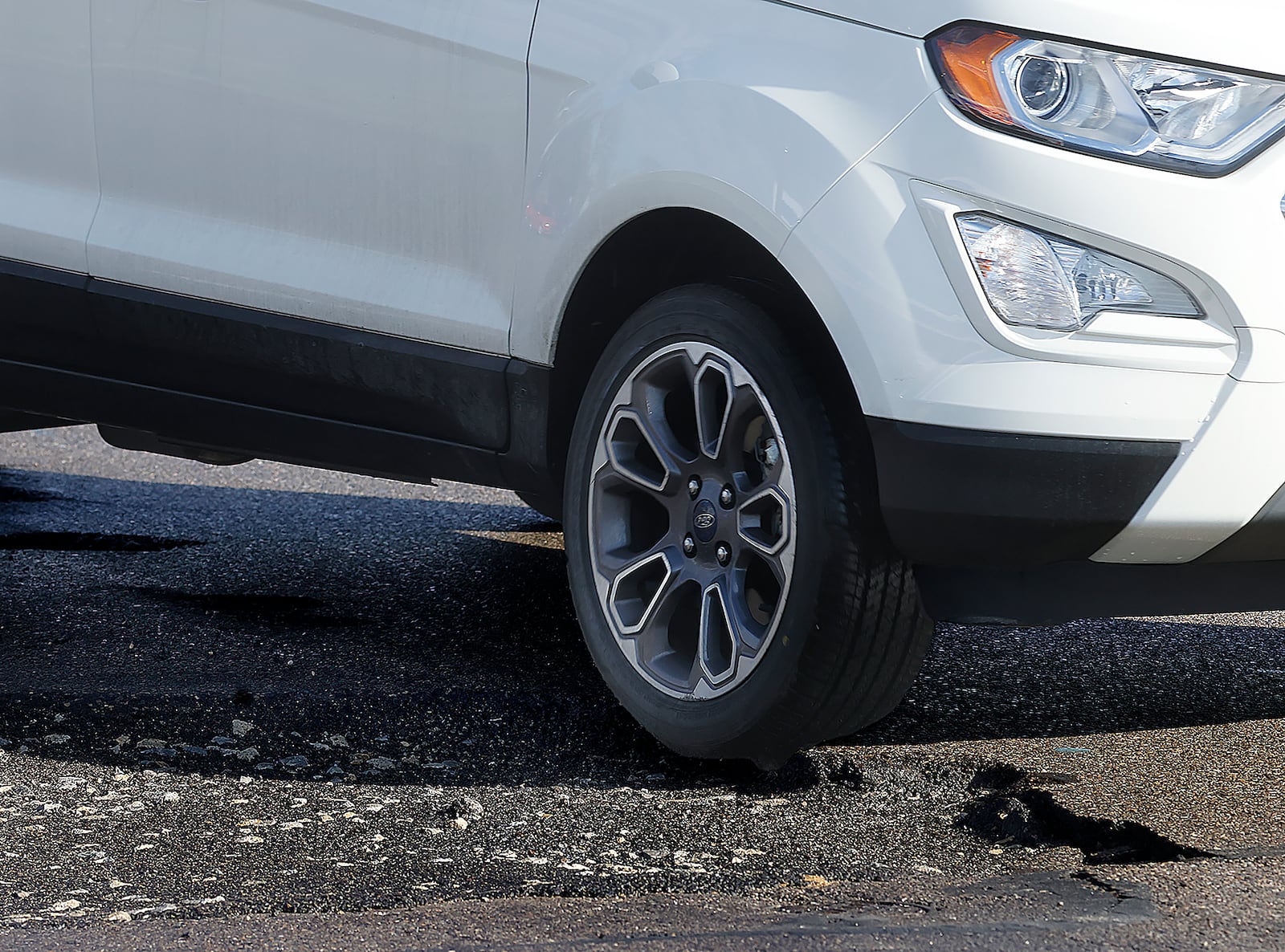 A large pothole on Dryden Road near Main Street in Moraine. MARSHALL GORBY\STAFF