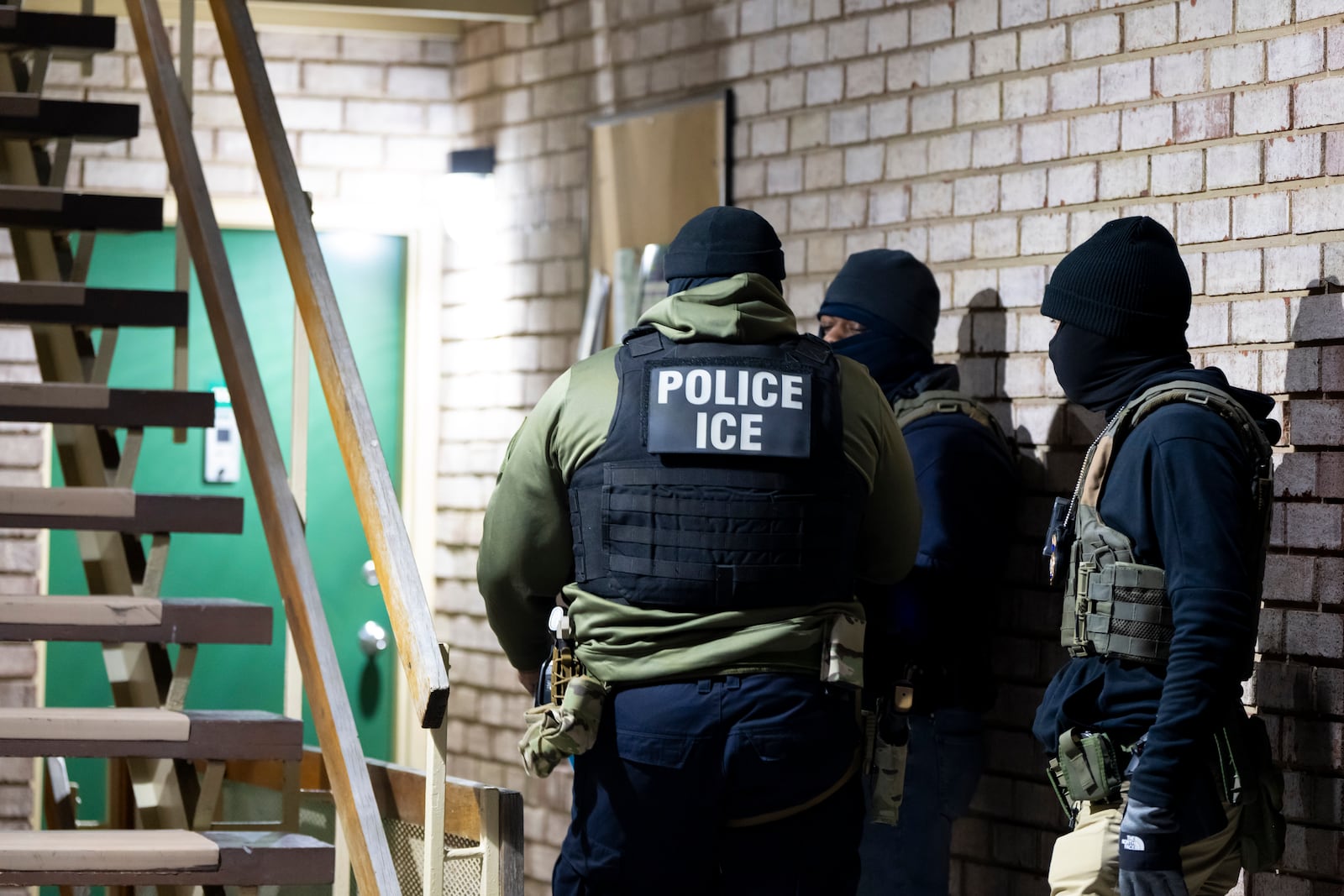 FILE - U.S. Immigration and Customs Enforcement officers wait to detain a person, Monday, Jan. 27, 2025, in Silver Spring, Md. (AP Photo/Alex Brandon, File)