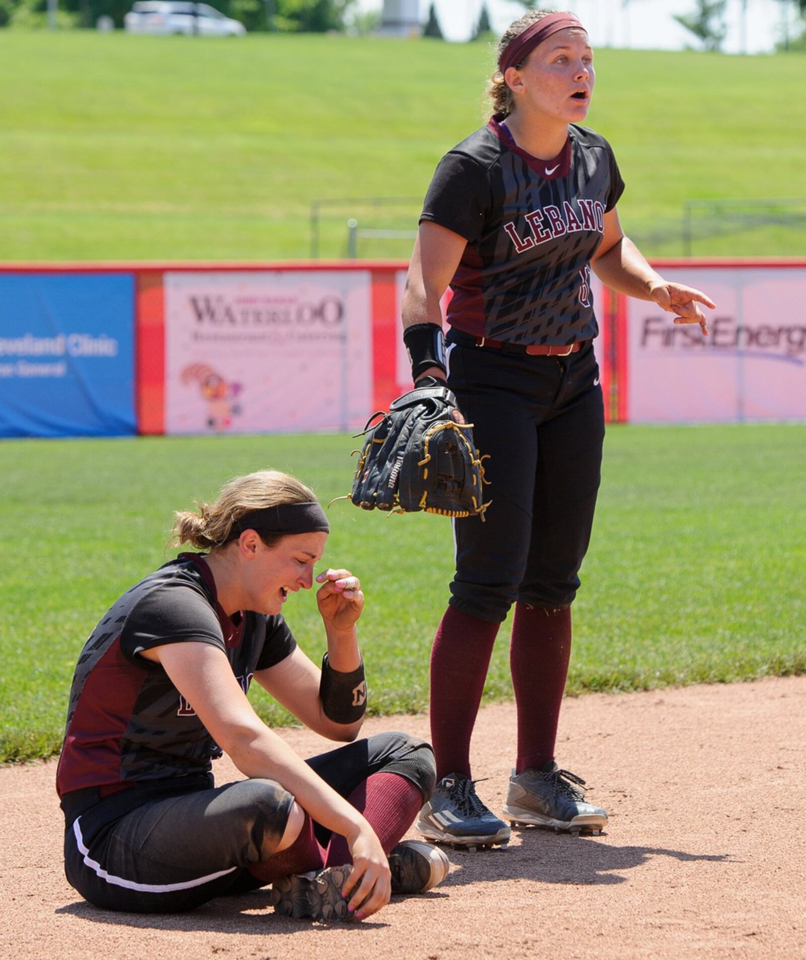 Lebanon’s Chloe Allen (right) and Alex Gibson react after the Warriors lost to Elyria in the Division I state final Saturday at Firestone Stadium in Akron. CONTRIBUTED PHOTO BY BRYANT BILLING