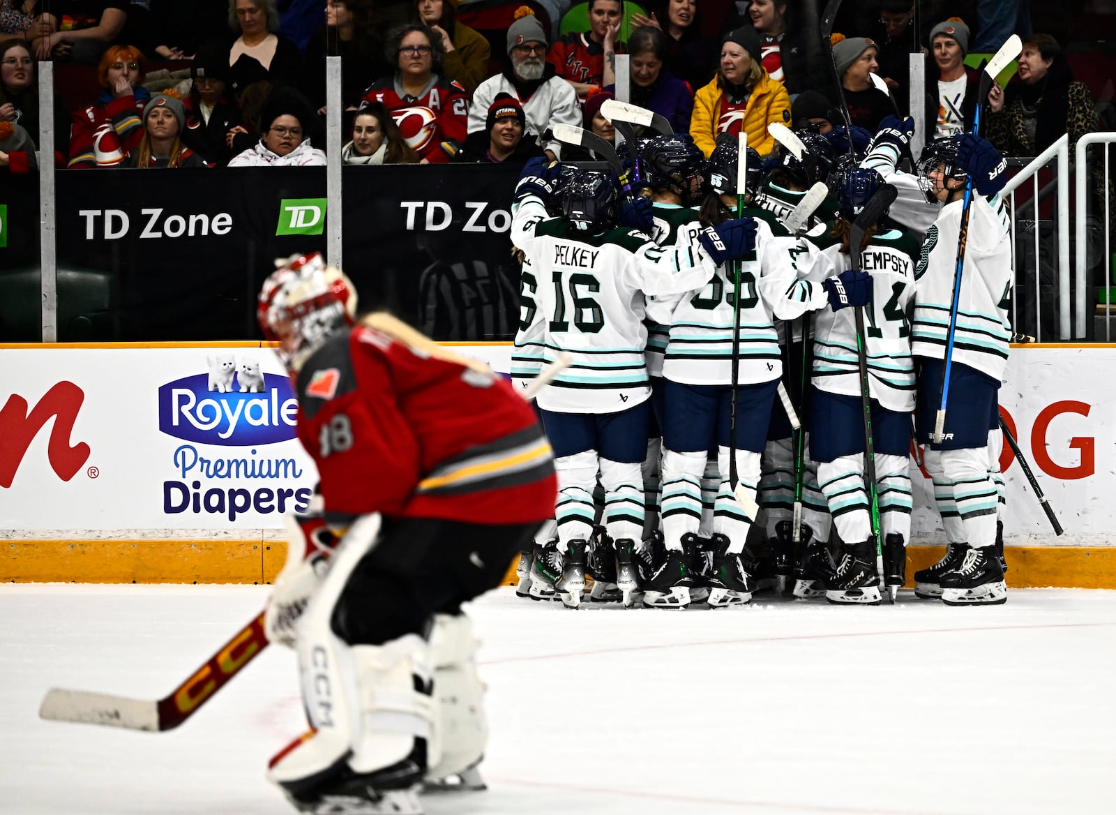 Ottawa Charge goaltender Emerance Maschmeyer (38) skates off the ice as the Boston Fleet celebrate the game winning goal of Susanna Tapani (77) during overtime period PWHL hockey action in Ottawa, on Thursday, Feb. 20, 2025. (Justin Tang/The Canadian Press via AP)