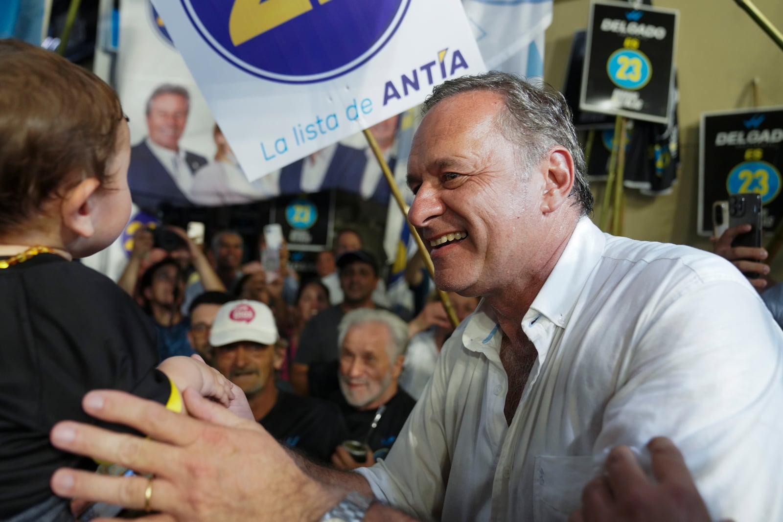 Alvaro Delgado, presidential candidate for the ruling National Party, smiles at a rally six days ahead of presidential elections, in Maldonado, Uruguay, Monday, Oct. 21, 2024. (AP Photo/Matilde Campodonico)