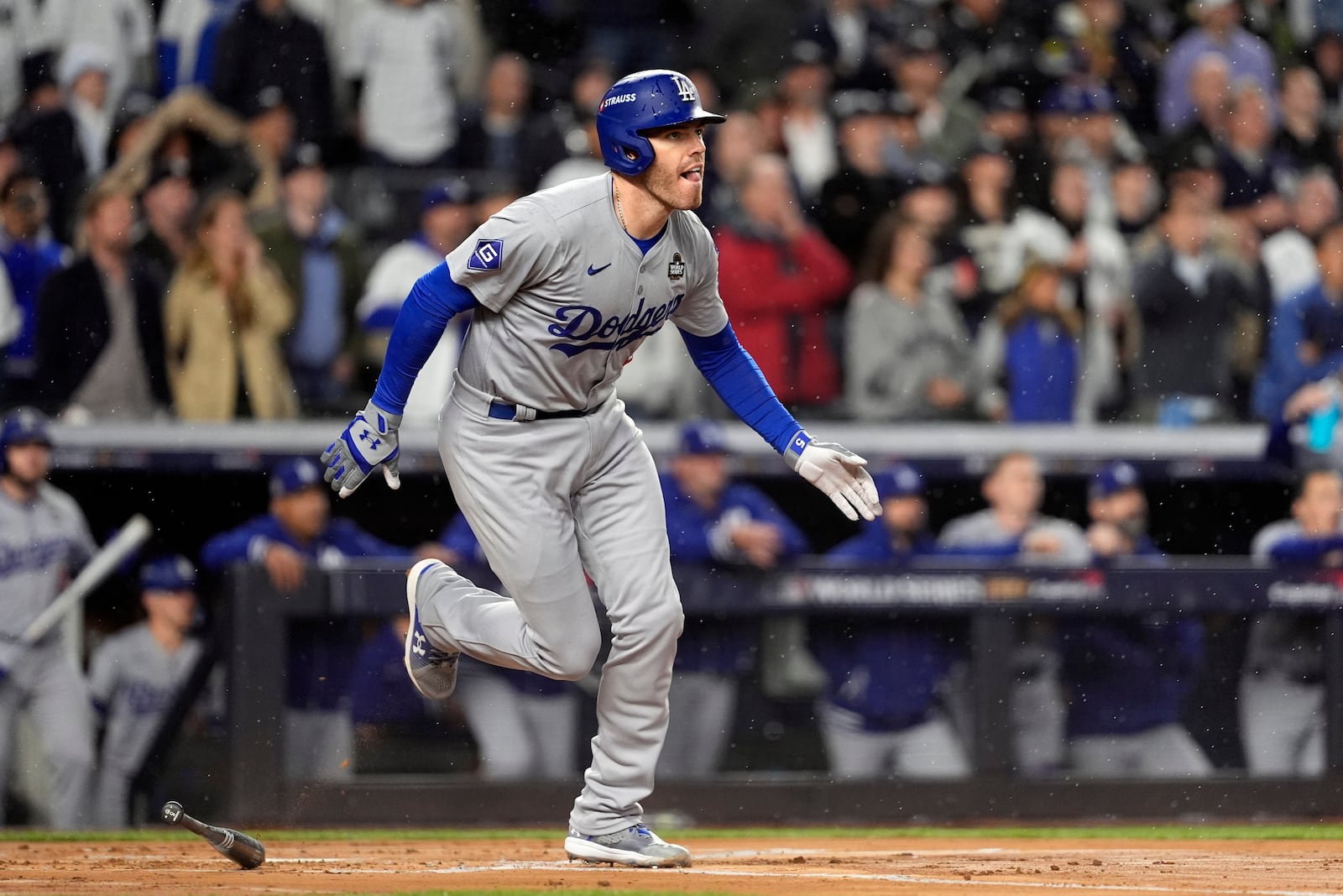 Los Angeles Dodgers' Freddie Freeman watches his two-run home run against the New York Yankees during the first inning in Game 4 of the baseball World Series, Tuesday, Oct. 29, 2024, in New York. (AP Photo/Godofredo A. Vásquez)