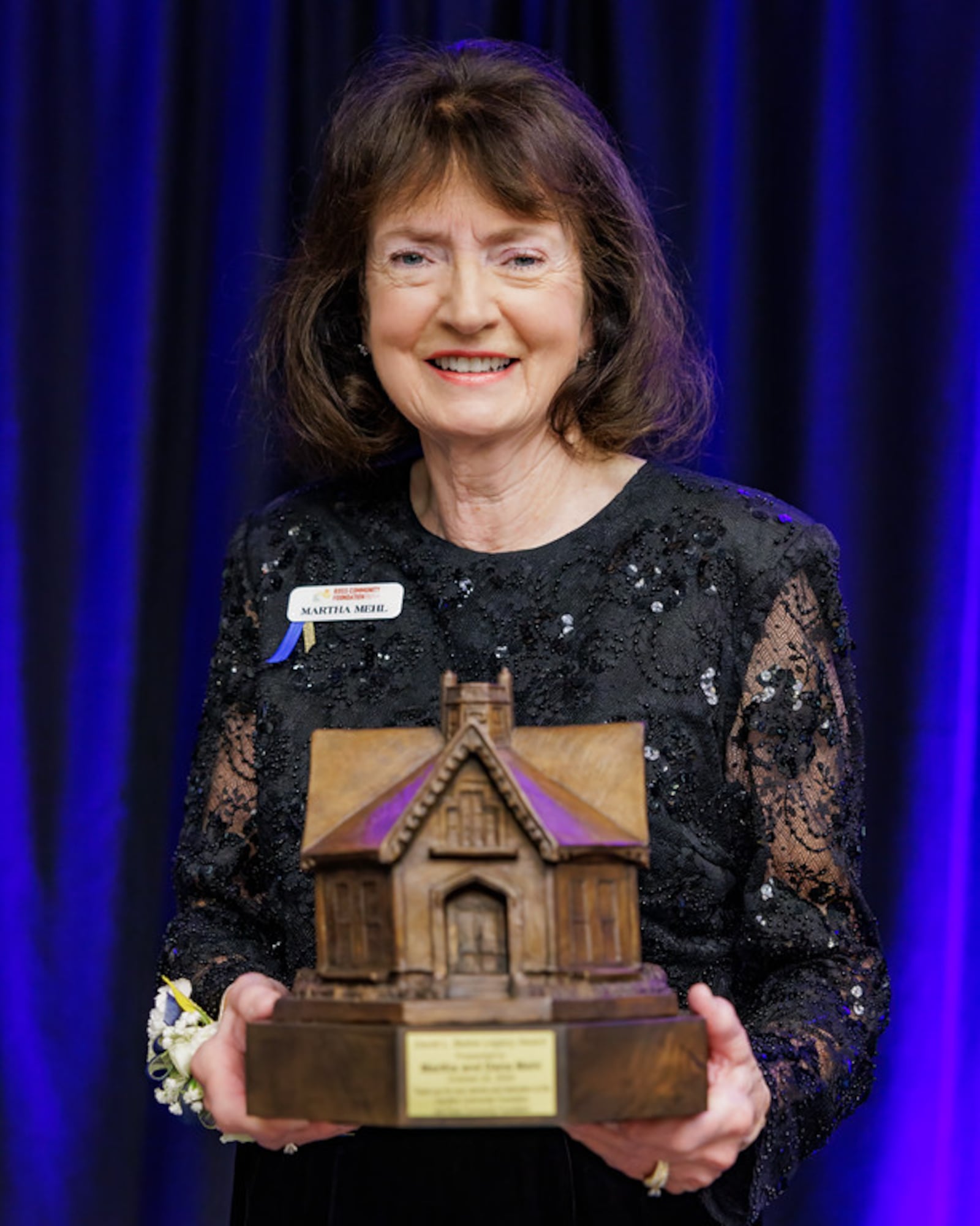 Martha Mehl accepts the 2024 David L. Belew Legacy Award at the Hamilton Community Foundation's annual dinner on Tuesday, Oct. 22, 2024. Martha and her late husband, Dana Mehl. Their journey of service started by collaborating on projects at Champion International and eventually led to creating the Ross Community Foundation, which is now an affiliate foundation of the Hamilton Community Foundation. PROVIDED