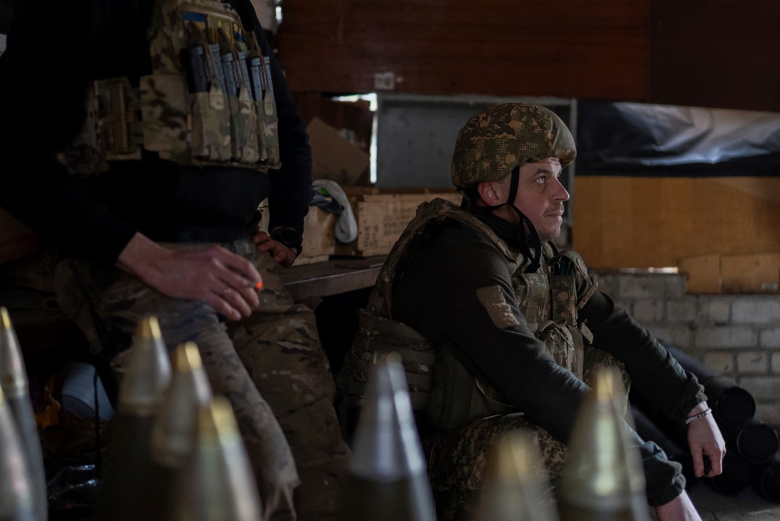 Ukrainian servicemen of Khartia brigade rest in the pause between firing towards Russian positions in Kharkiv region, Ukraine, Wednesday, March 12, 2025. (AP Photo/Alex Babenko)