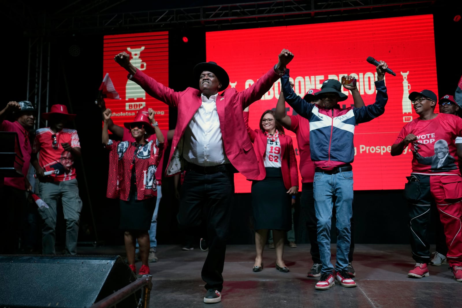 Botswana Democratic Party president Mokgweetsi Masisi dances during his election rally, a day before elections in Gaborone, Botswana, Tuesday, Oct. 29, 2024. (AP Photo/Themba Hadebe)