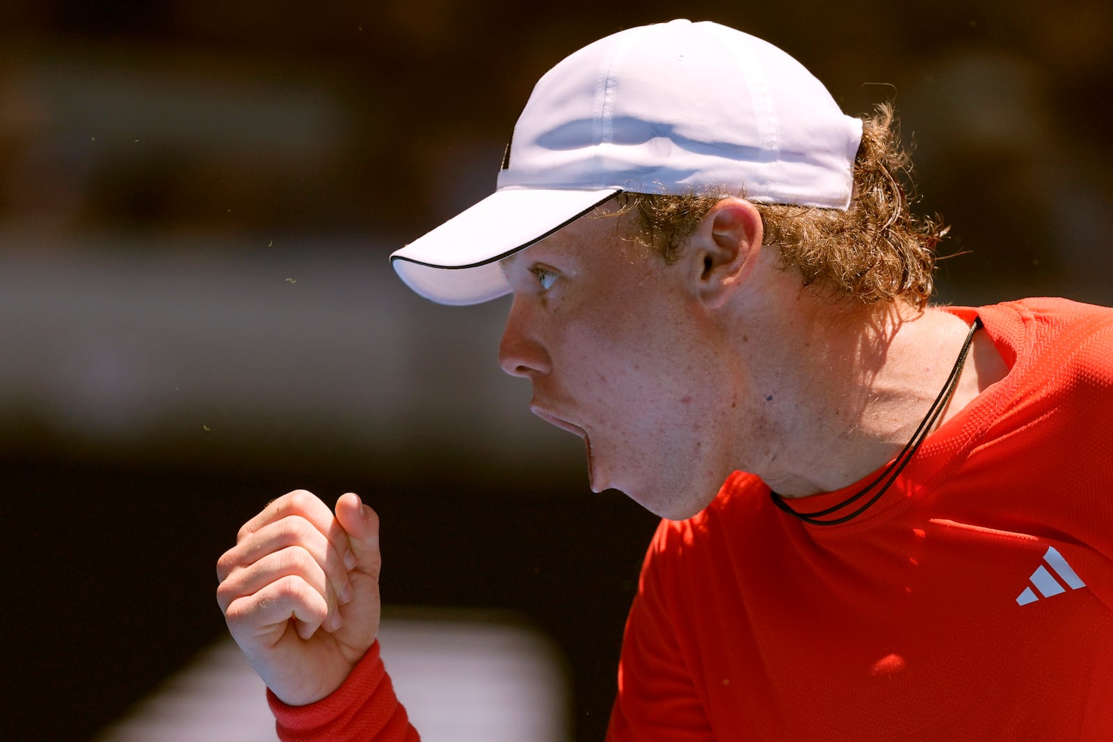 Alex Michelsen of the U.S. reacts after winning a point against Stefanos Tsitsipas of Greece during their first round match at the Australian Open tennis championship in Melbourne, Australia, Monday, Jan. 13, 2025. (AP Photo/Ng Han Guan)