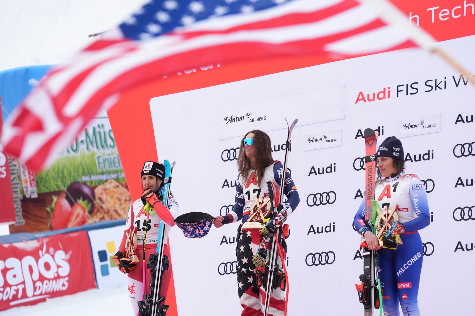 From left, second placed Austria's Stephanie Venier, the winner United States' Lauren Macuga and third placed Italy's Federica Brignone celebrate after an alpine ski, women's World Cup super G race, in St. Anton, Austria, Sunday, Jan. 12, 2025. (AP Photo/Giovanni Auletta)