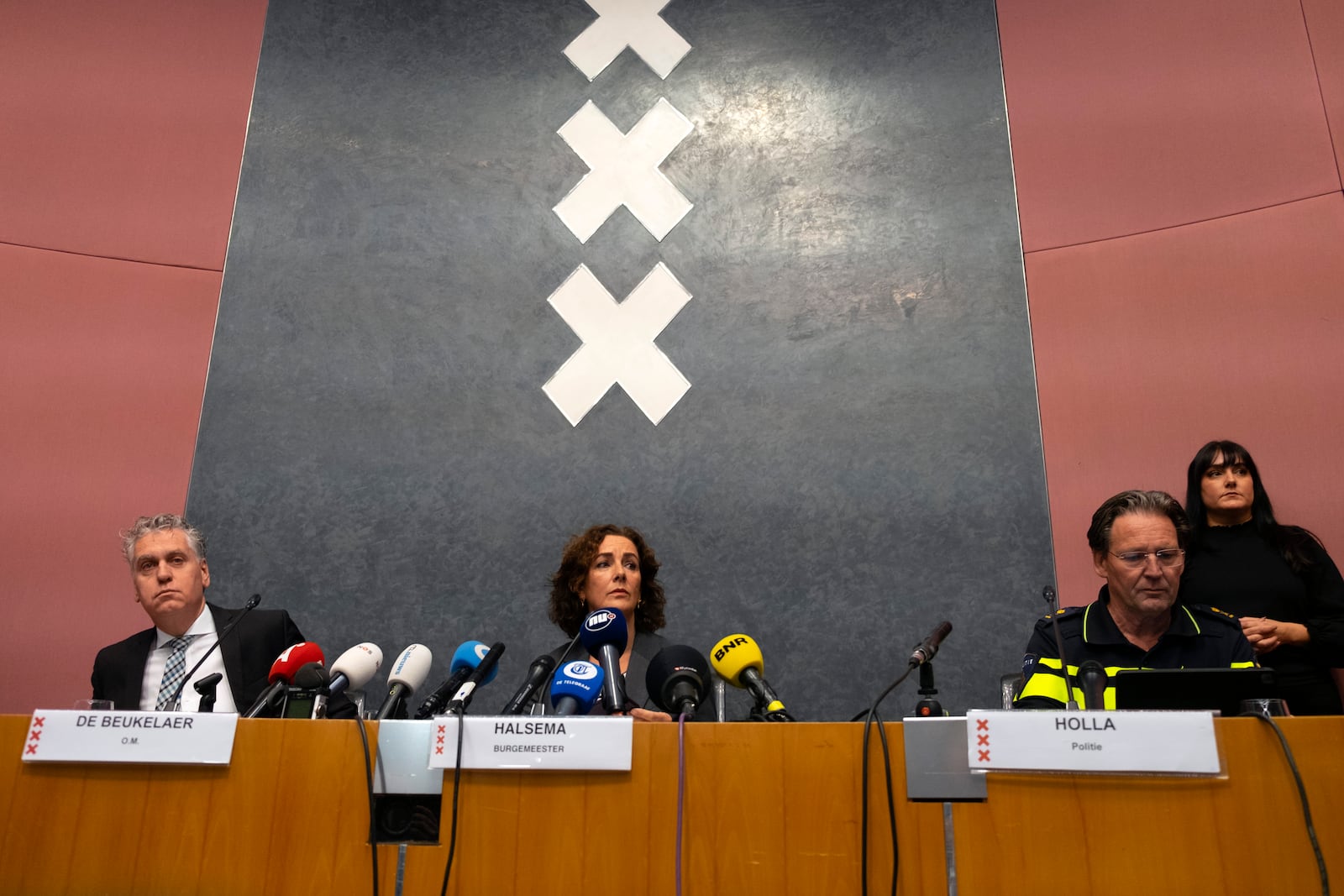 Amsterdam's Mayor Femke Halsema, centre, acting Amsterdam police chief Peter Holla, left, and head of the Amsterdam public prosecutor's office René de Beukelaer hold a news conference after Israeli fans and protesters clashed overnight after a soccer match, in Amsterdam, Netherlands, Friday Nov, 8, 2024. (AP Photo/Mike Corder)