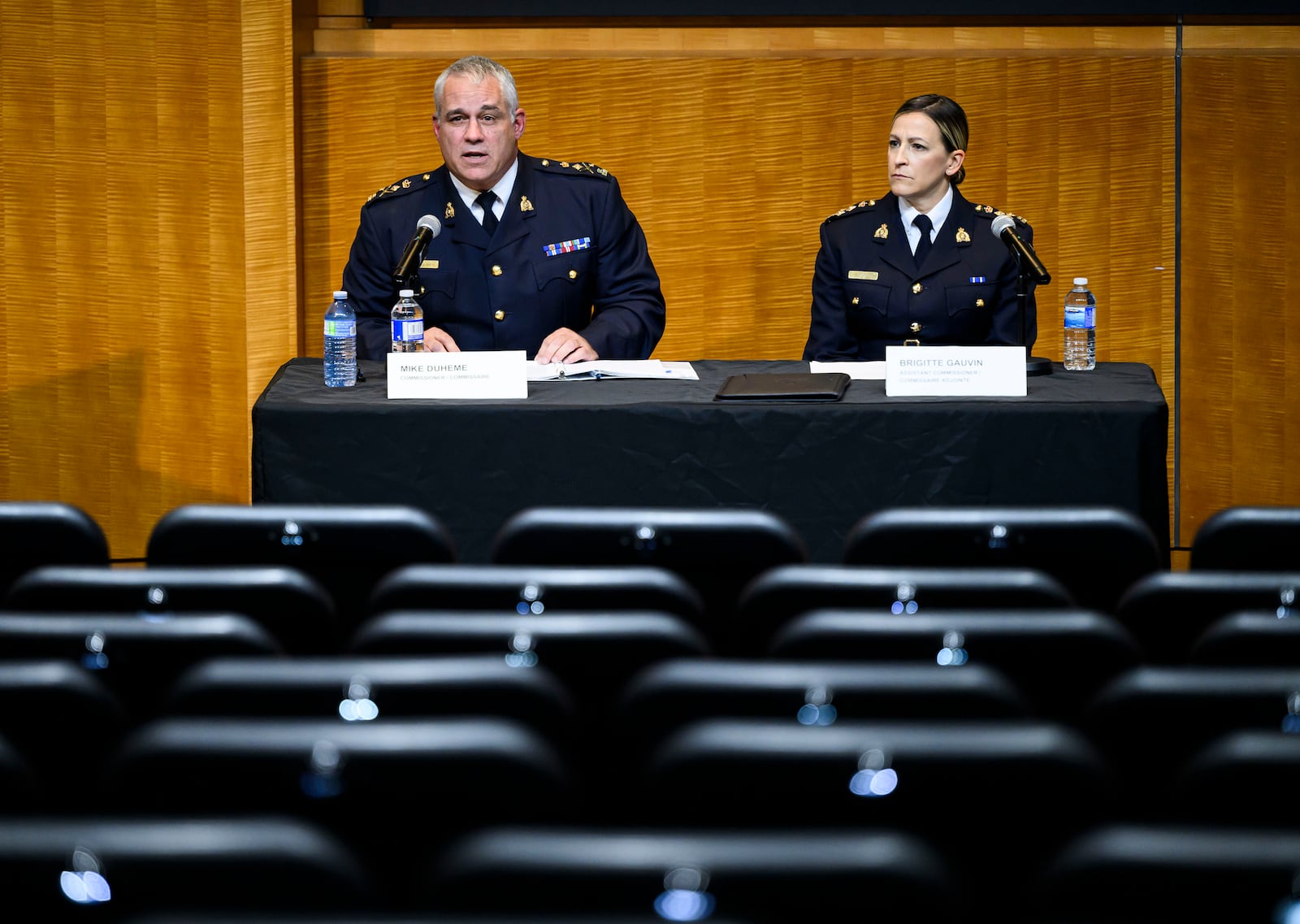 RCMP Commissioner Mike Duheme, left, and Assistant Commissioner Brigitte Gauvin participate in a news conference at RCMP National Headquarters in Ottawa, Ontaio, Monday, Oct. 14, 2024. (Justin Tang/The Canadian Press via AP)