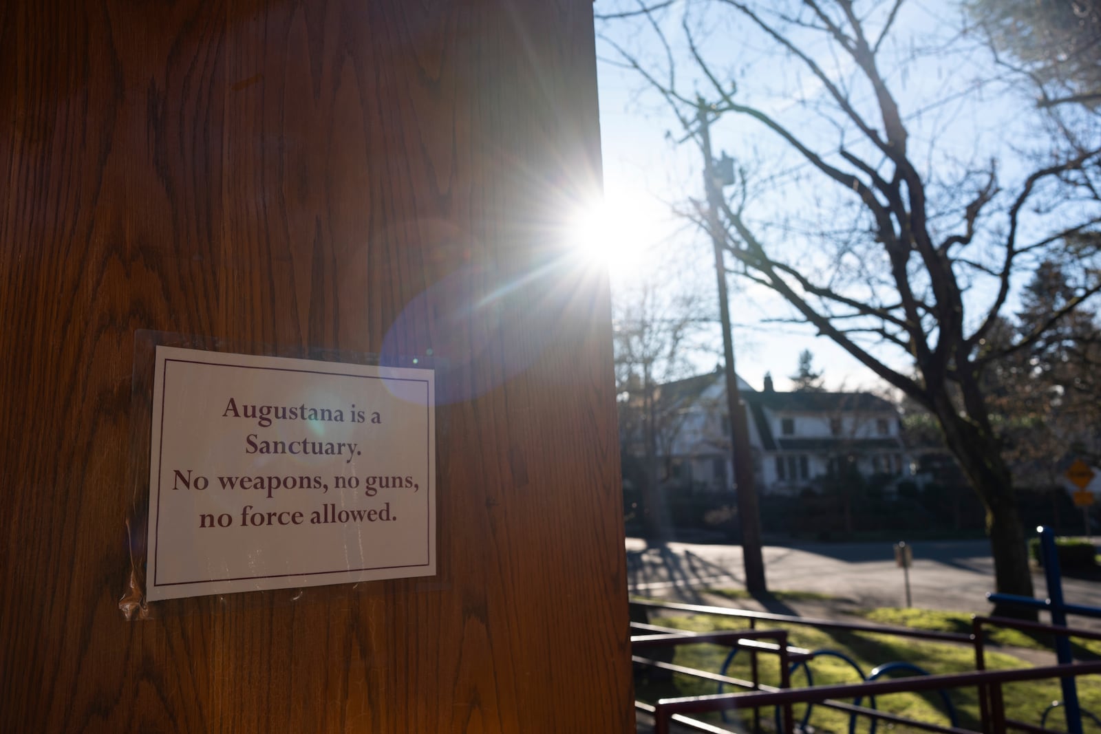 A sign reading "Augustana is a Sanctuary" is displayed on a door at the Augustana Lutheran Church, Thursday, Jan. 9, 2025, in Portland, Oregon. (AP Photo/Jenny Kane)